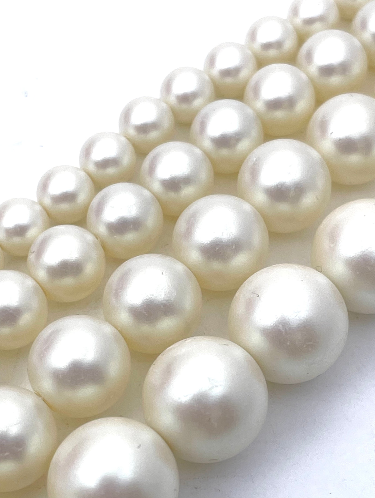 6mm, 8mm, 10mm, 12mm ivory shell pearls shown for size reference