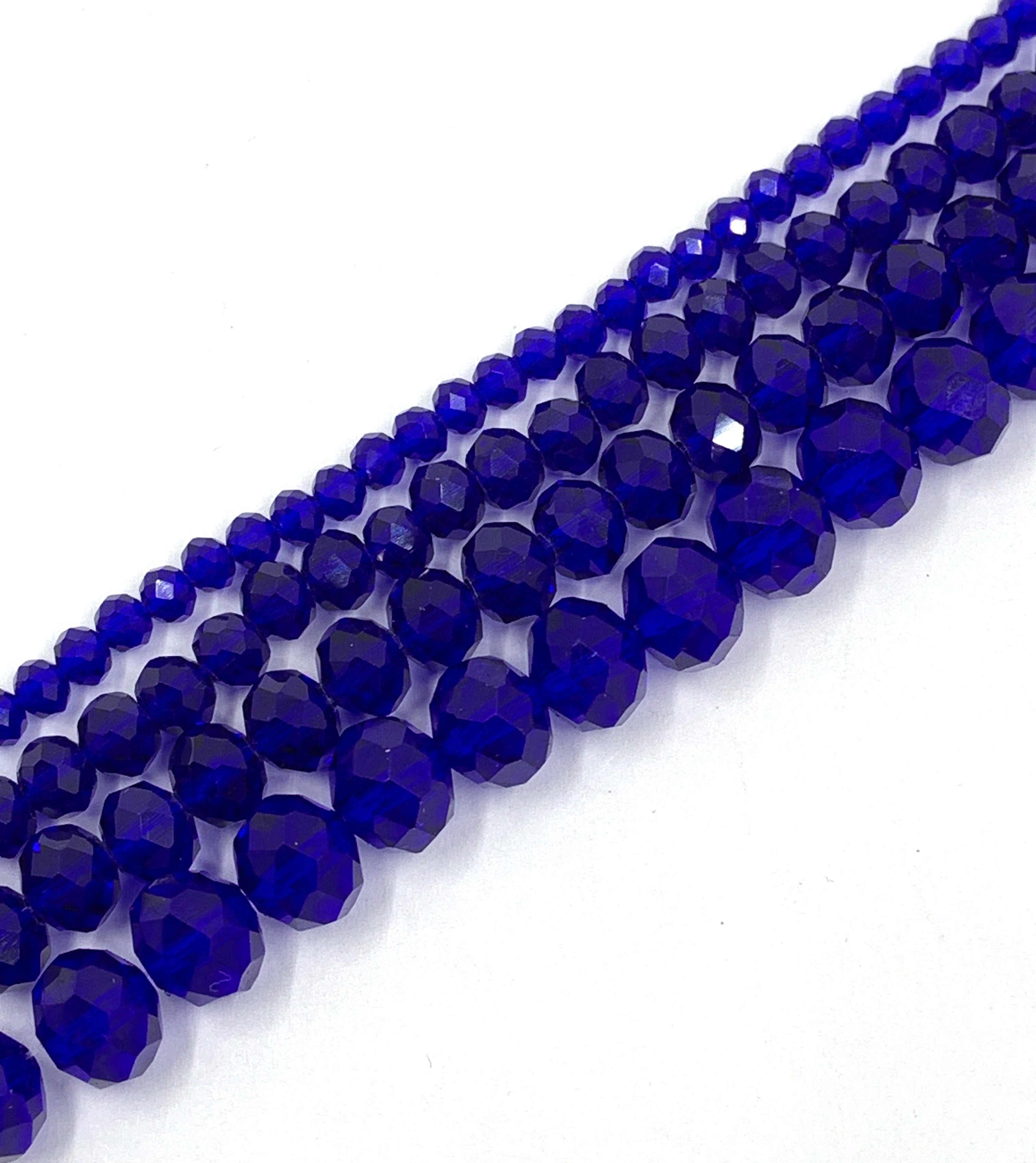 Transparent blue rondelle glass beads with faceted cut