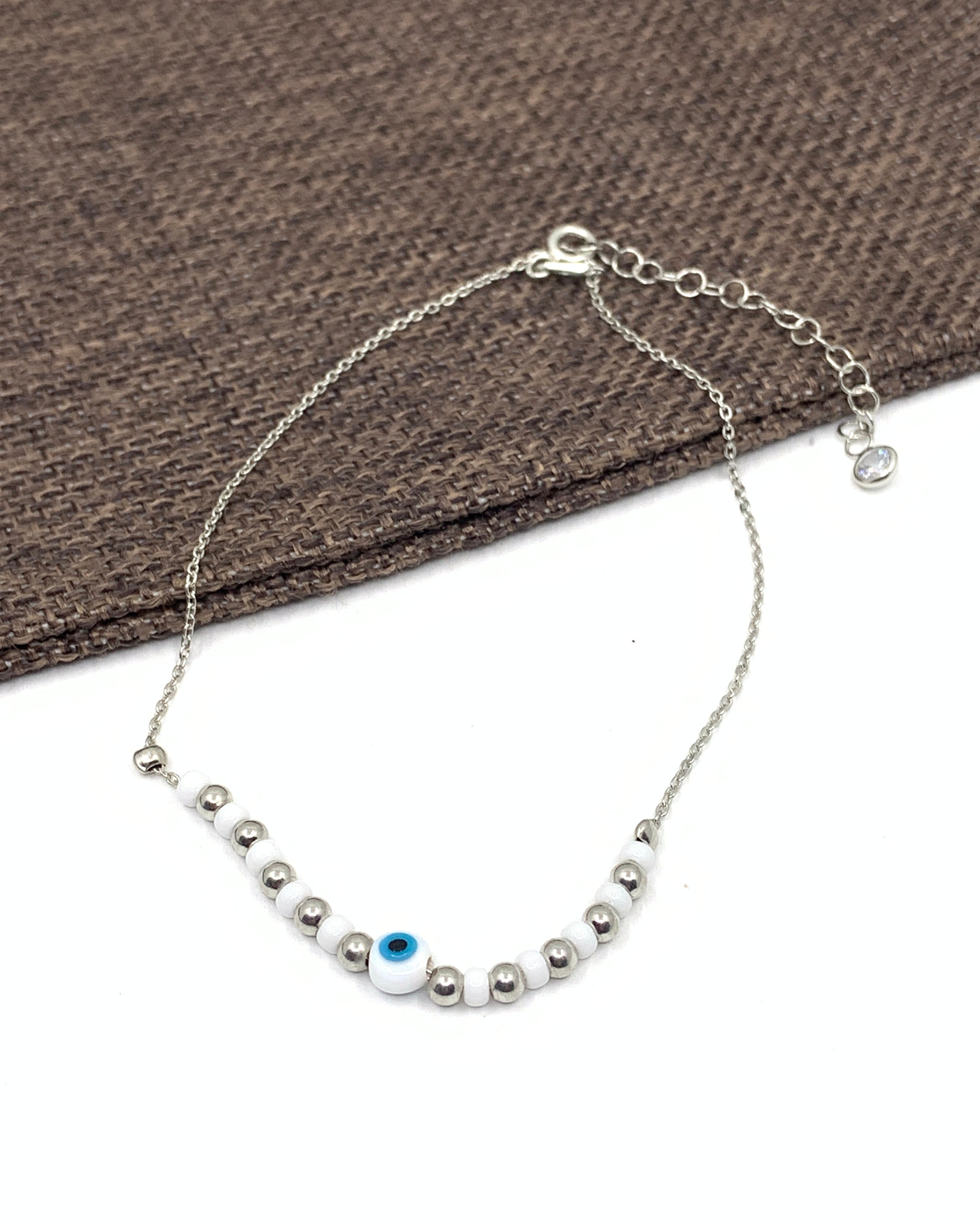 White evil eye anklet