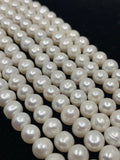 Freshwater pearls against a black background