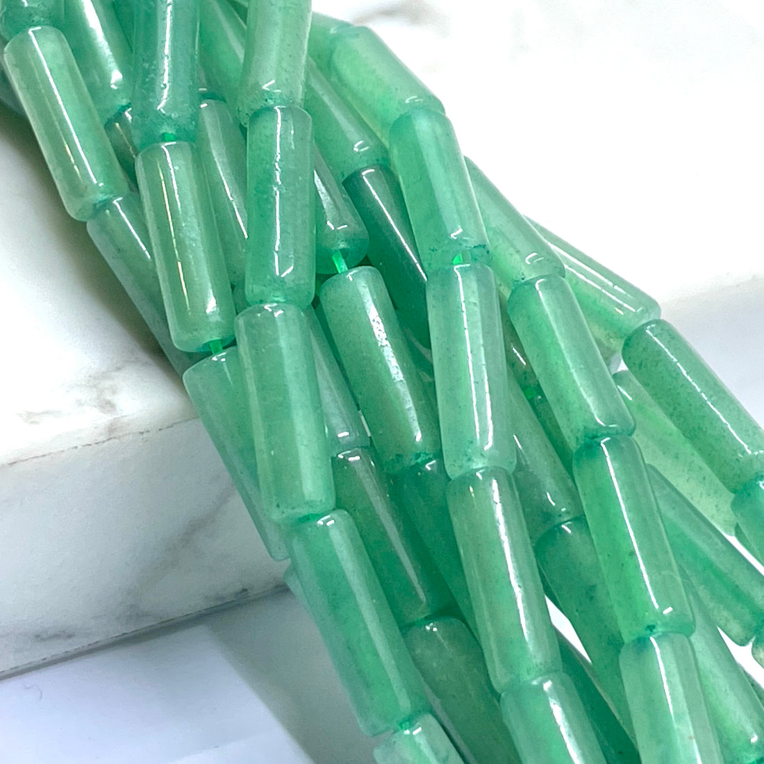 Labraorite, dragon bloodstone, flourite, green spot jasper, clear quartz and green aventurine tube beads
