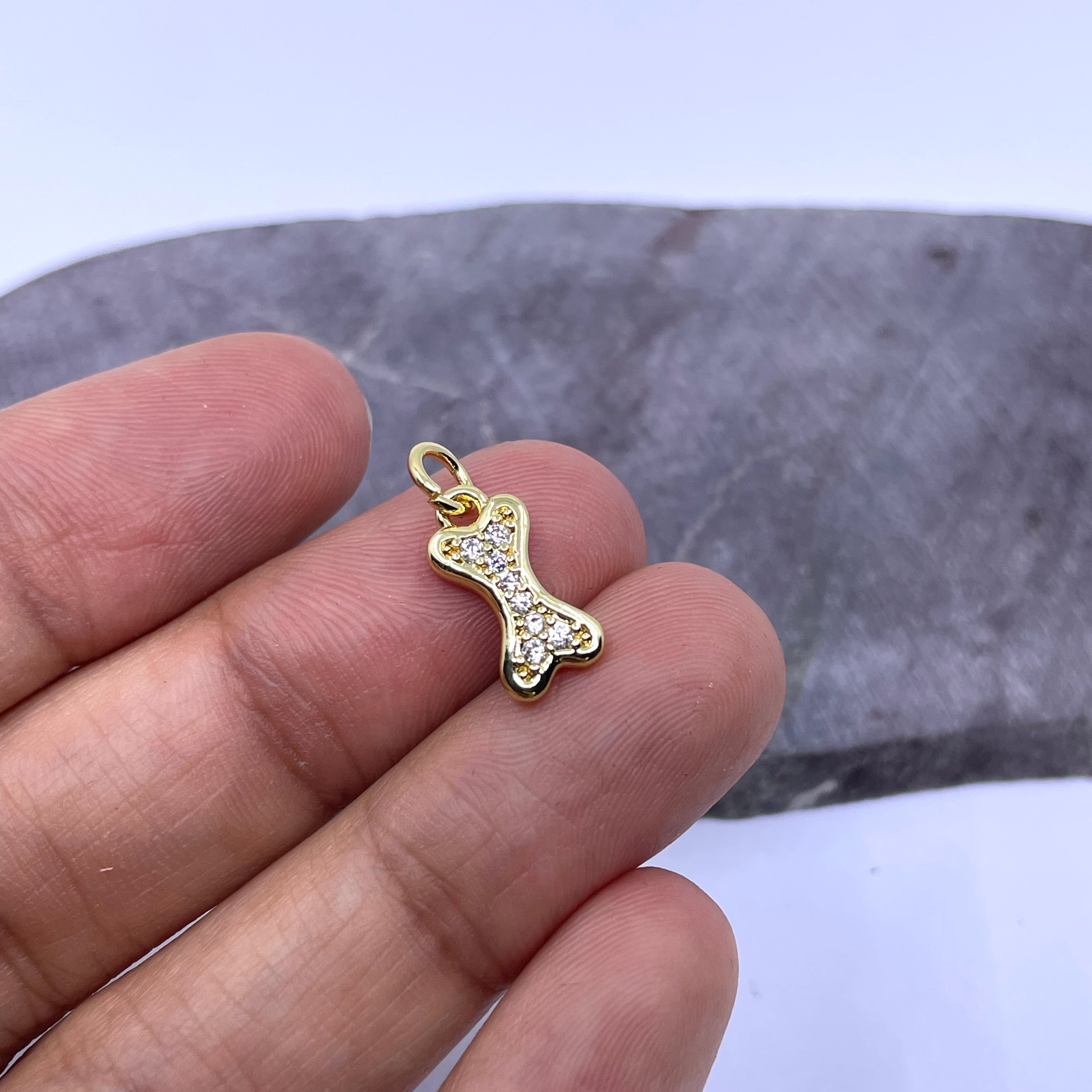 Cubic zirconia dog bone charm