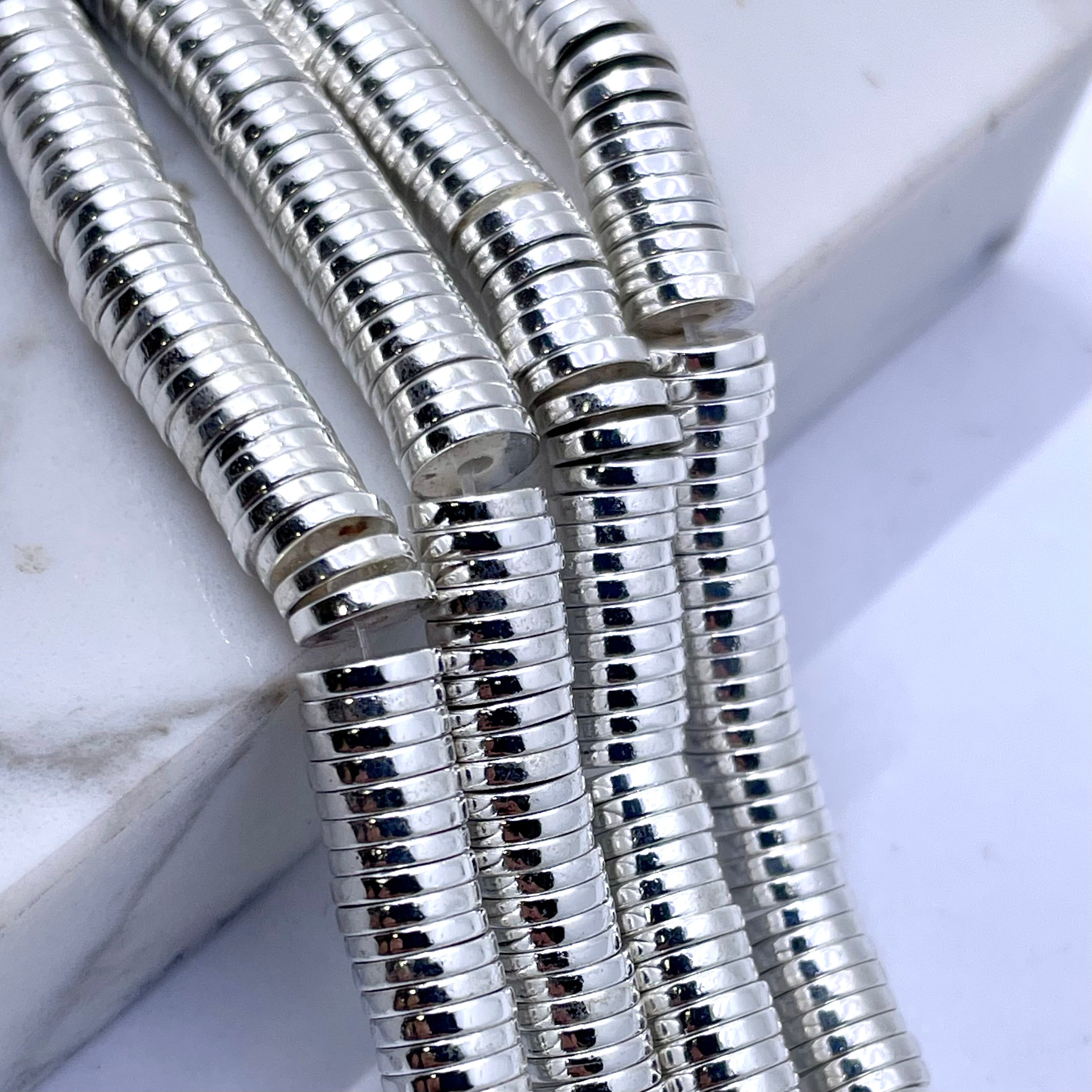 Silver flat disc hematite