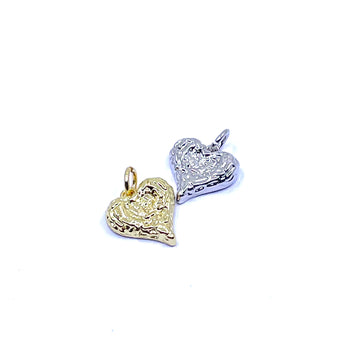 Two textured heart-shaped charms, one in yellow gold and one in silver, shown on a plain white background.