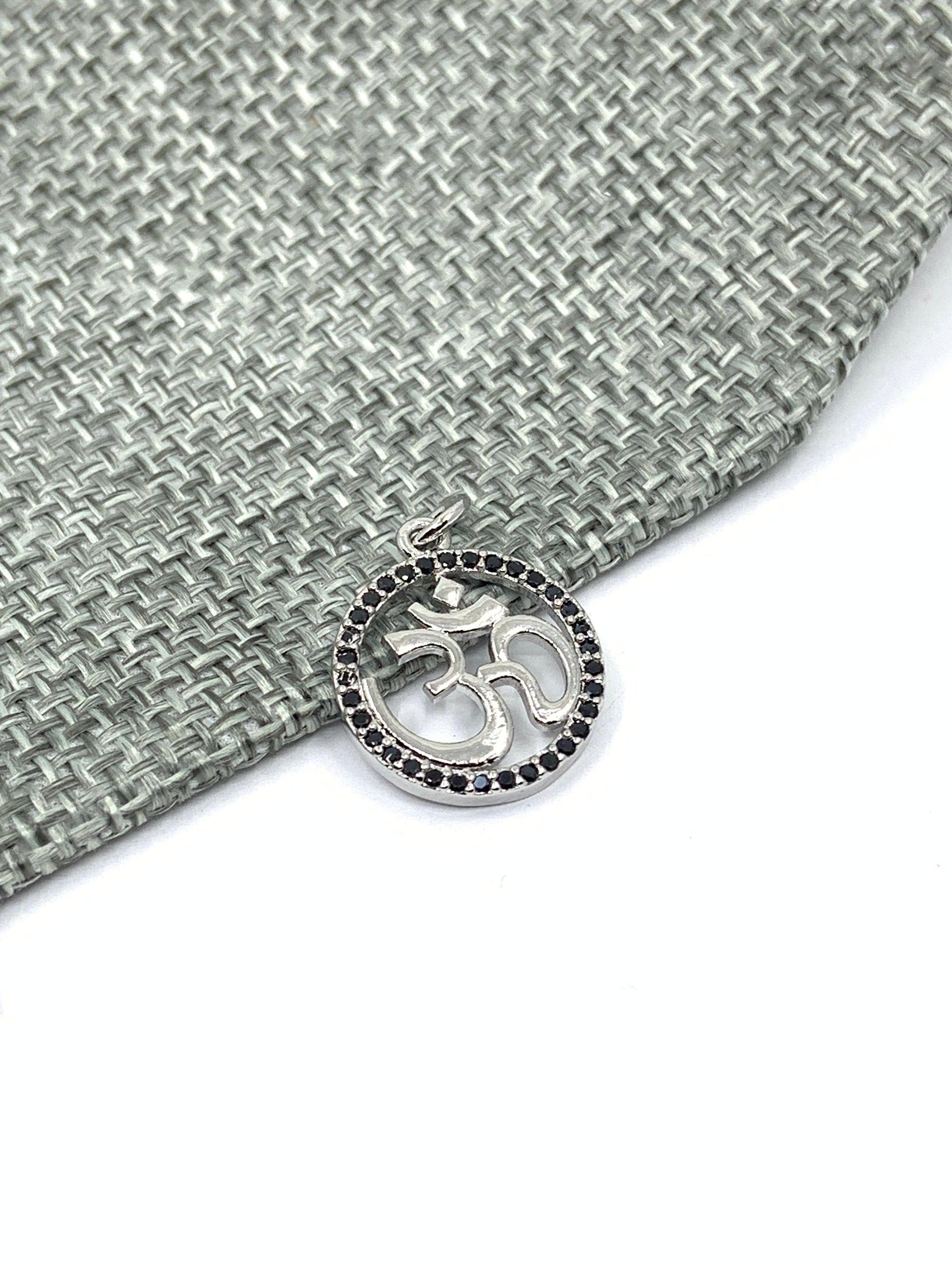 Silver om pendant with black cz stones