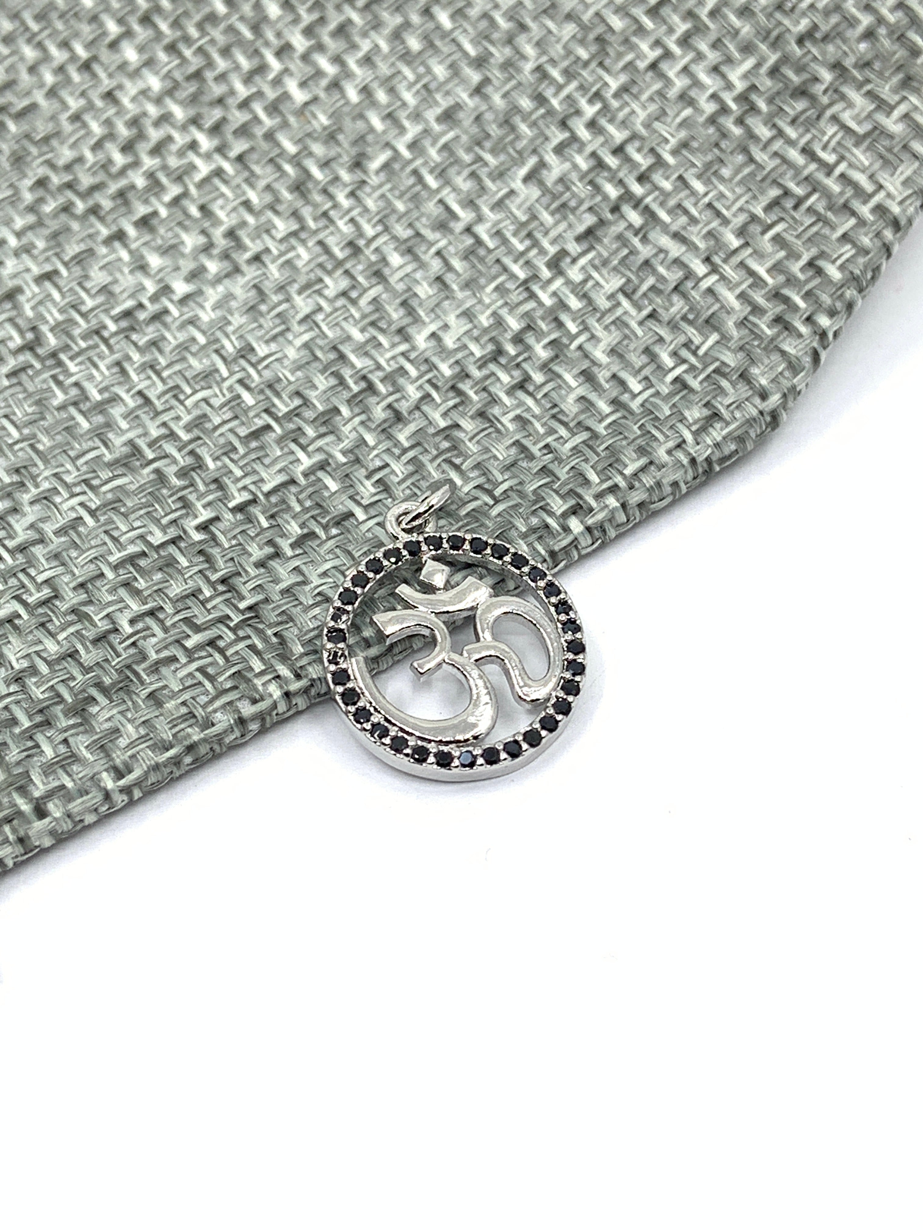 Silver om pendant with black cz stones