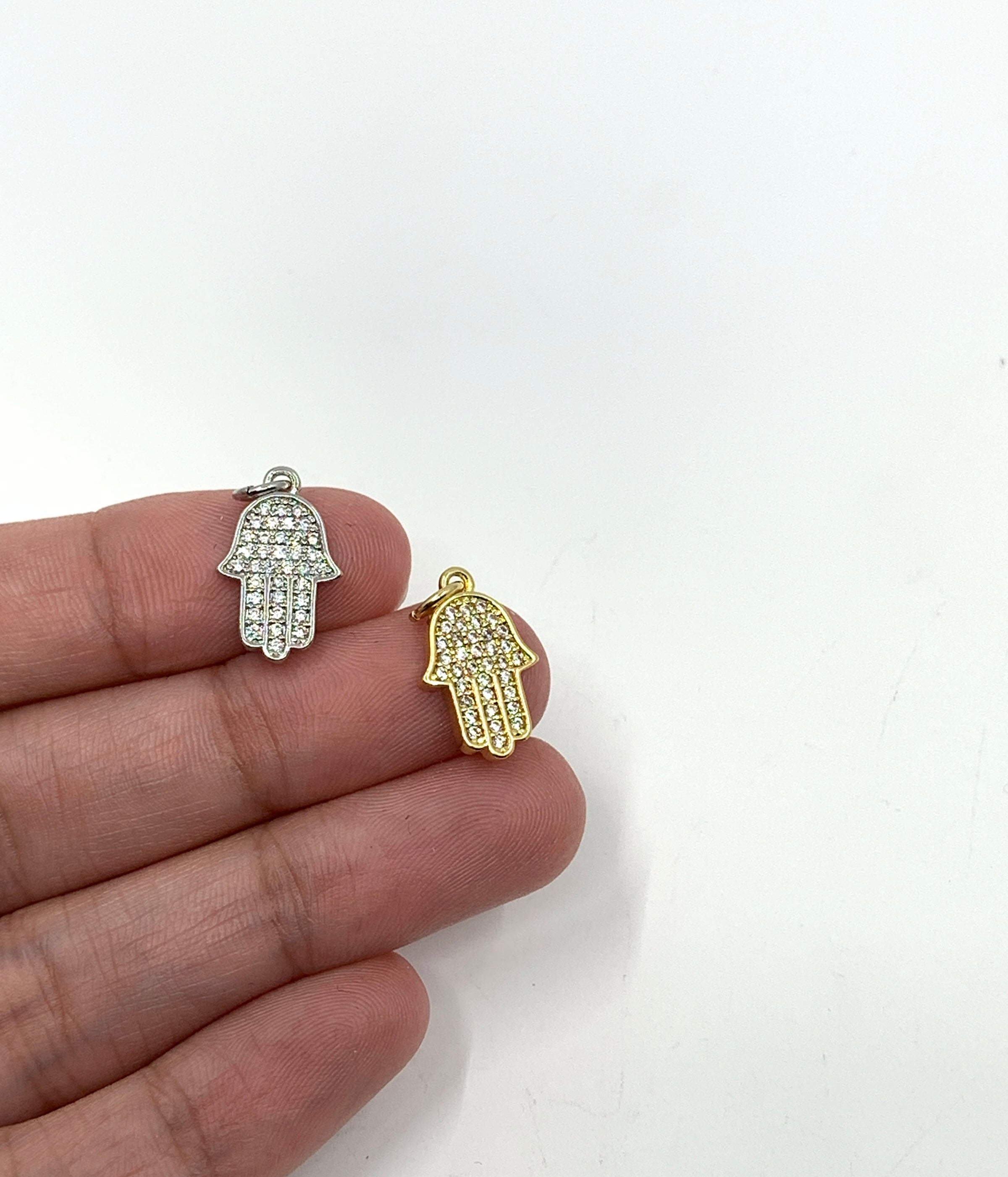 Charms shown on hand for size reference