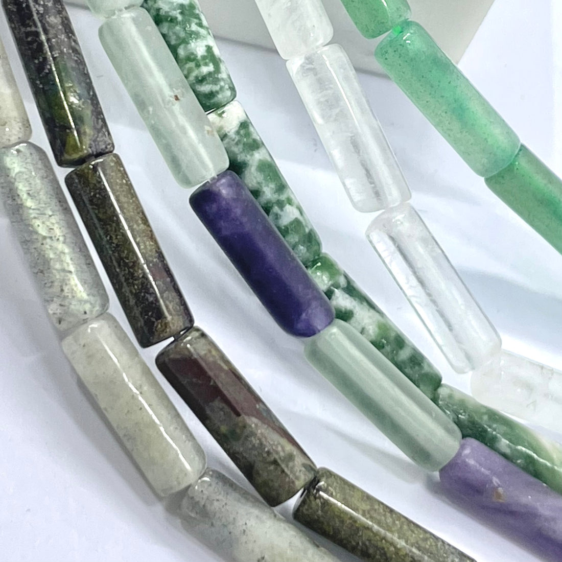 Labraorite, dragon bloodstone, flourite, green spot jasper, clear quartz and green aventurine tube beads
