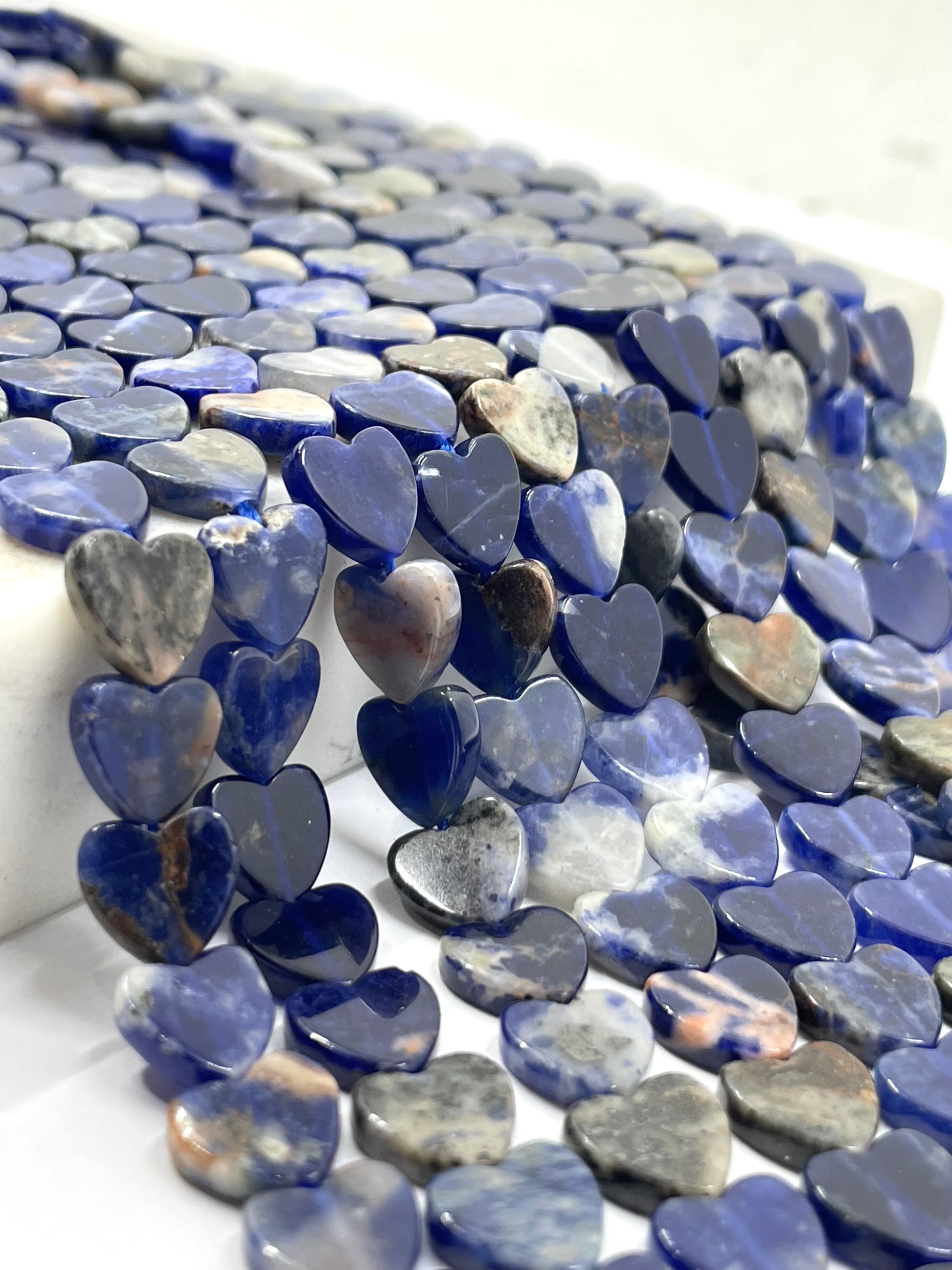 Sunset SODALITE Heart beads in close up