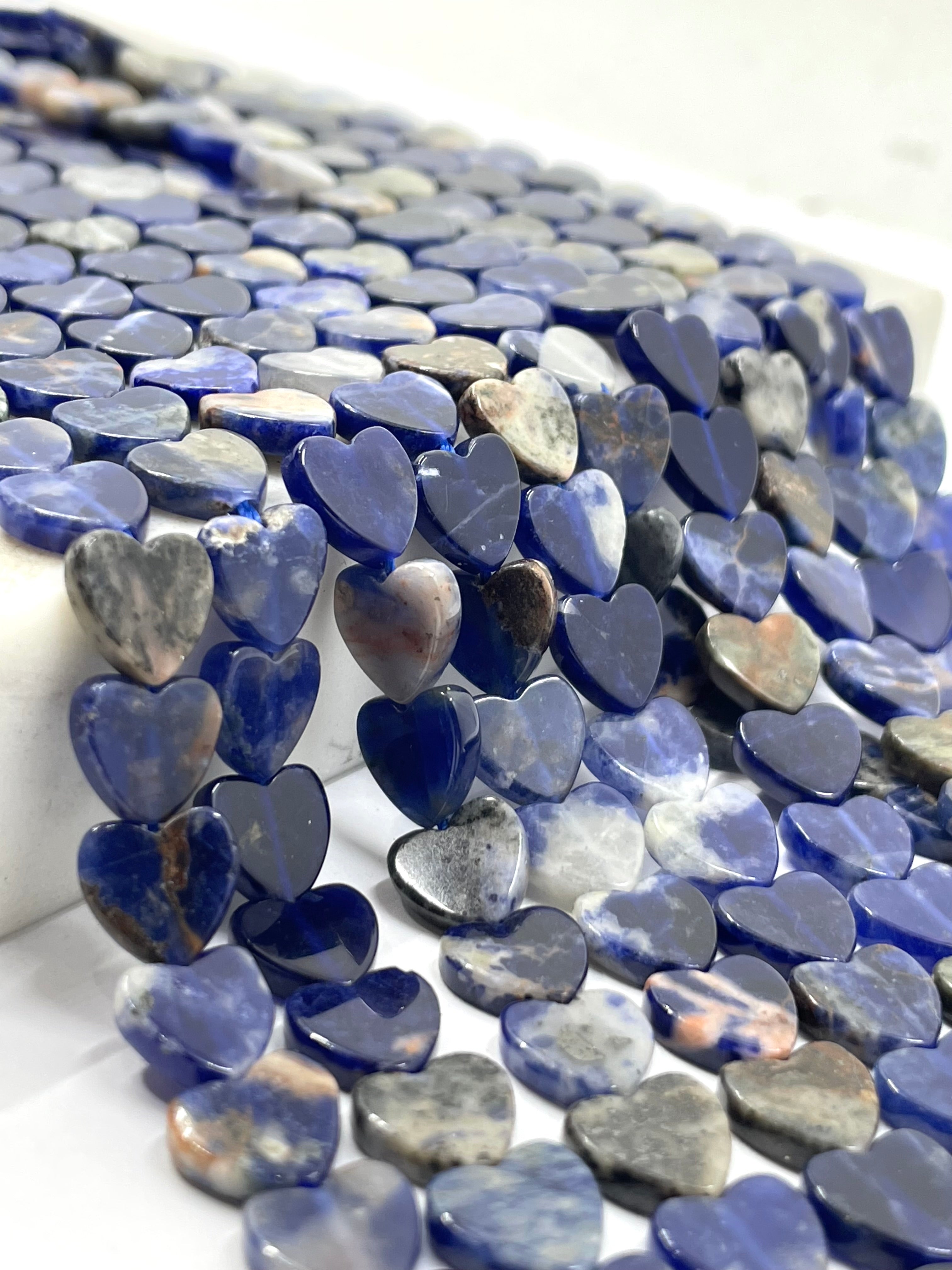 Sunset SODALITE Heart beads in close up