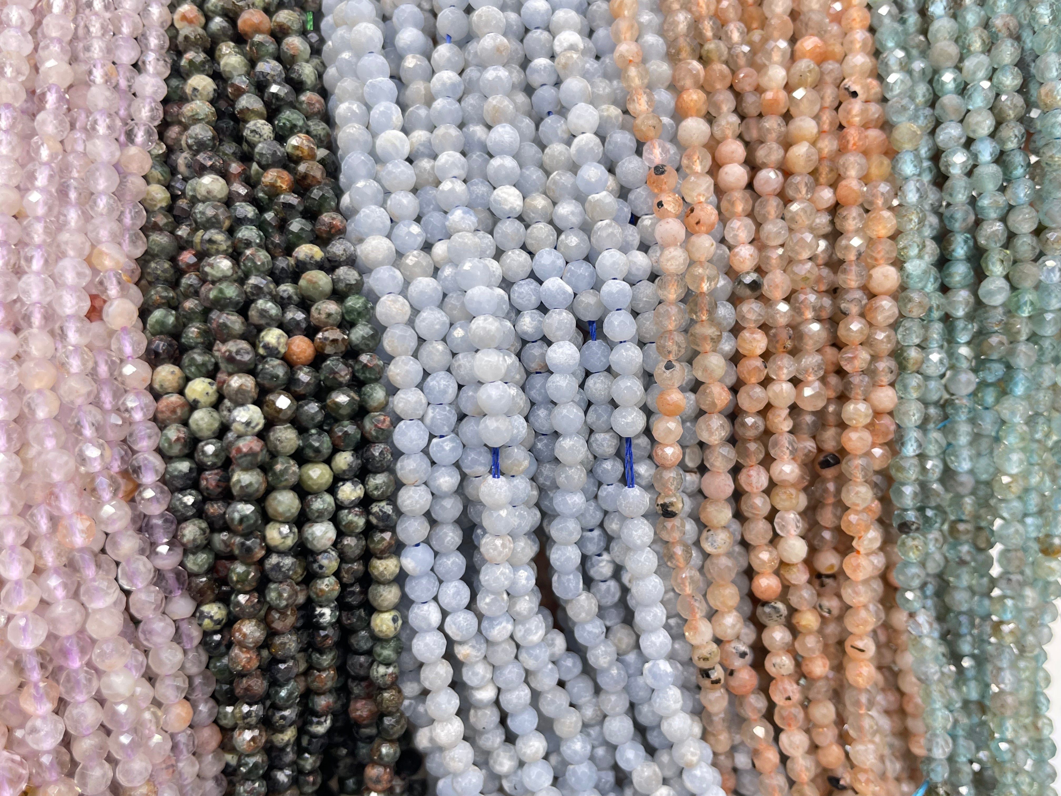 3mm round faceted light amethyst, serpentine, angelite, sunstone and light apatite displayed from left to right.