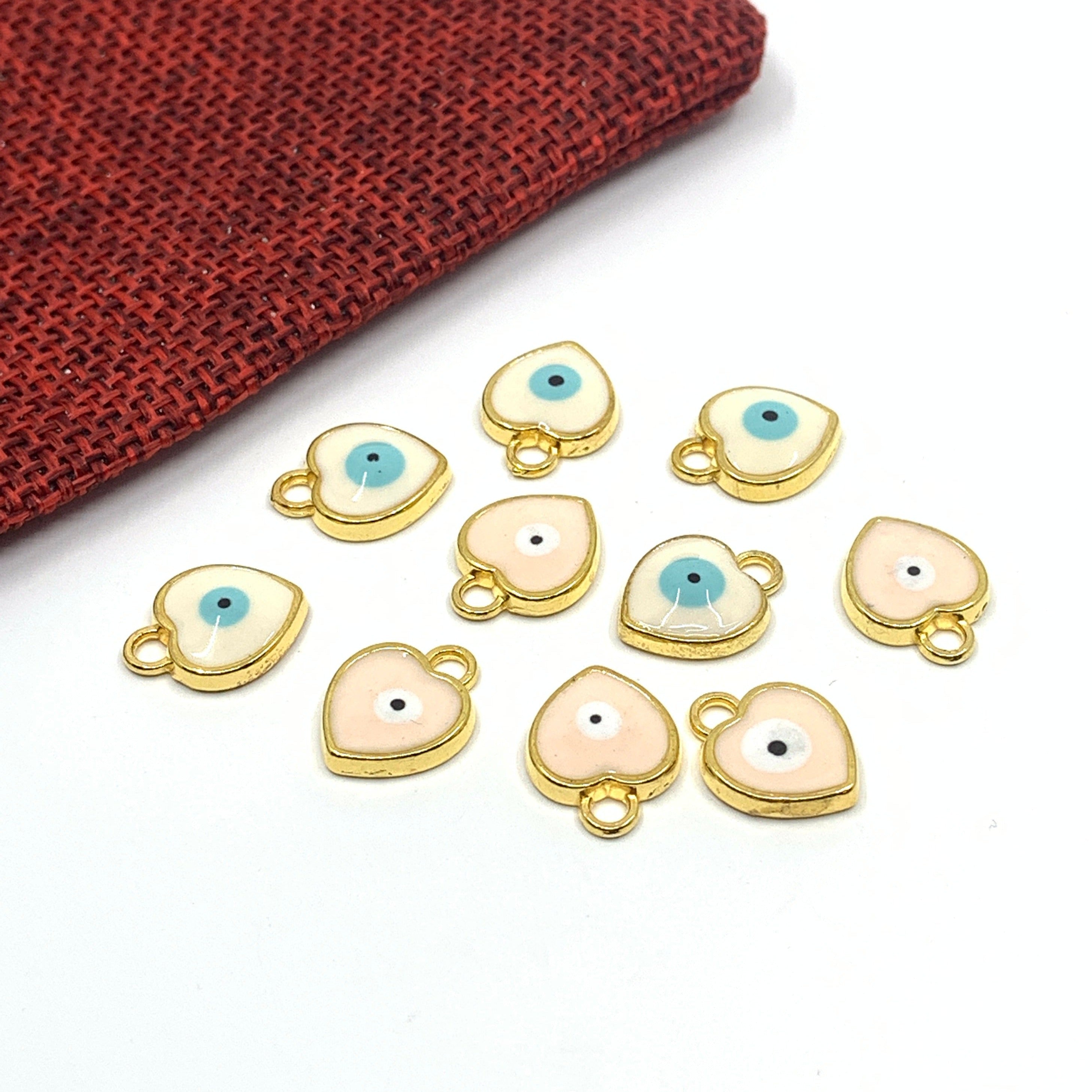 White and pink enamel heart evil eye charm