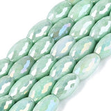 Green glass beads in rice beads
