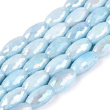 Light blue beads on a white background