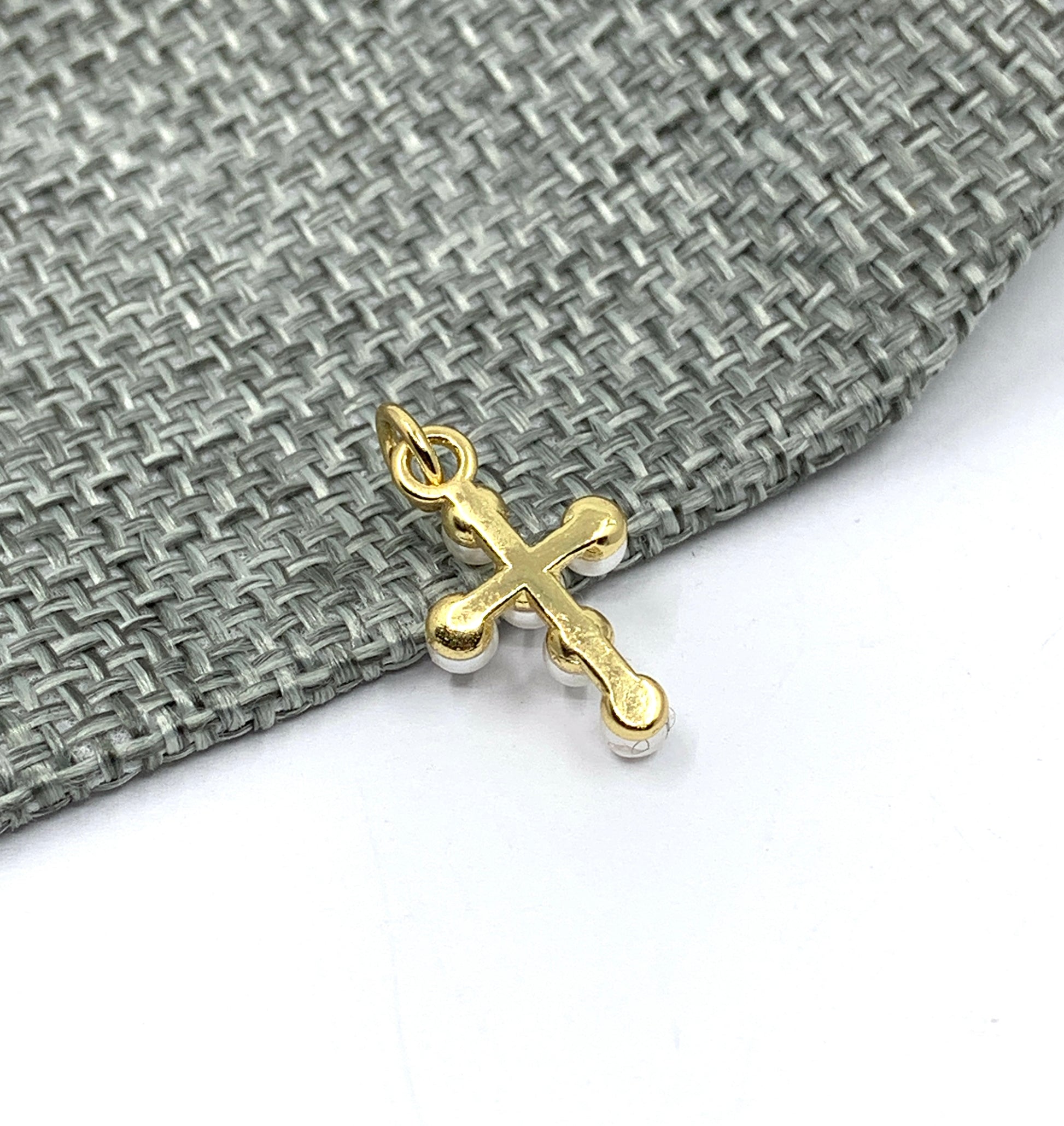 Back side of cross charm pendant