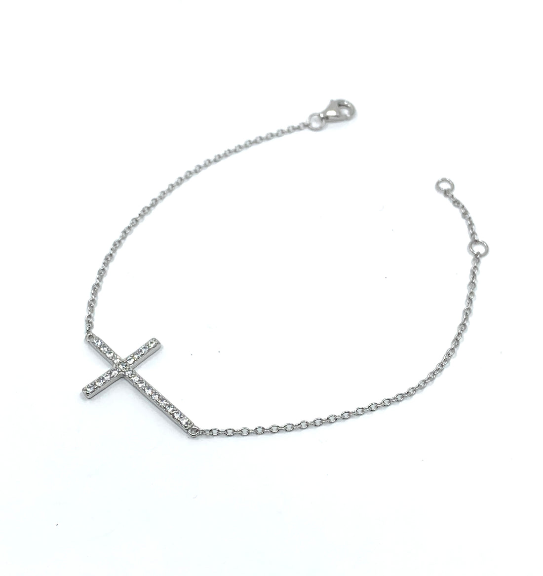 Sterling Silver CZ Cross Bracelet worn on wrist for size reference
