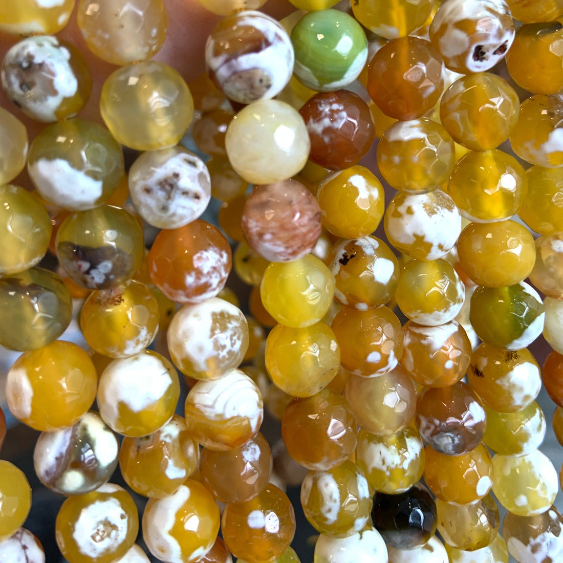 Orange Fire Agate, Faceted Round, Strands are held together