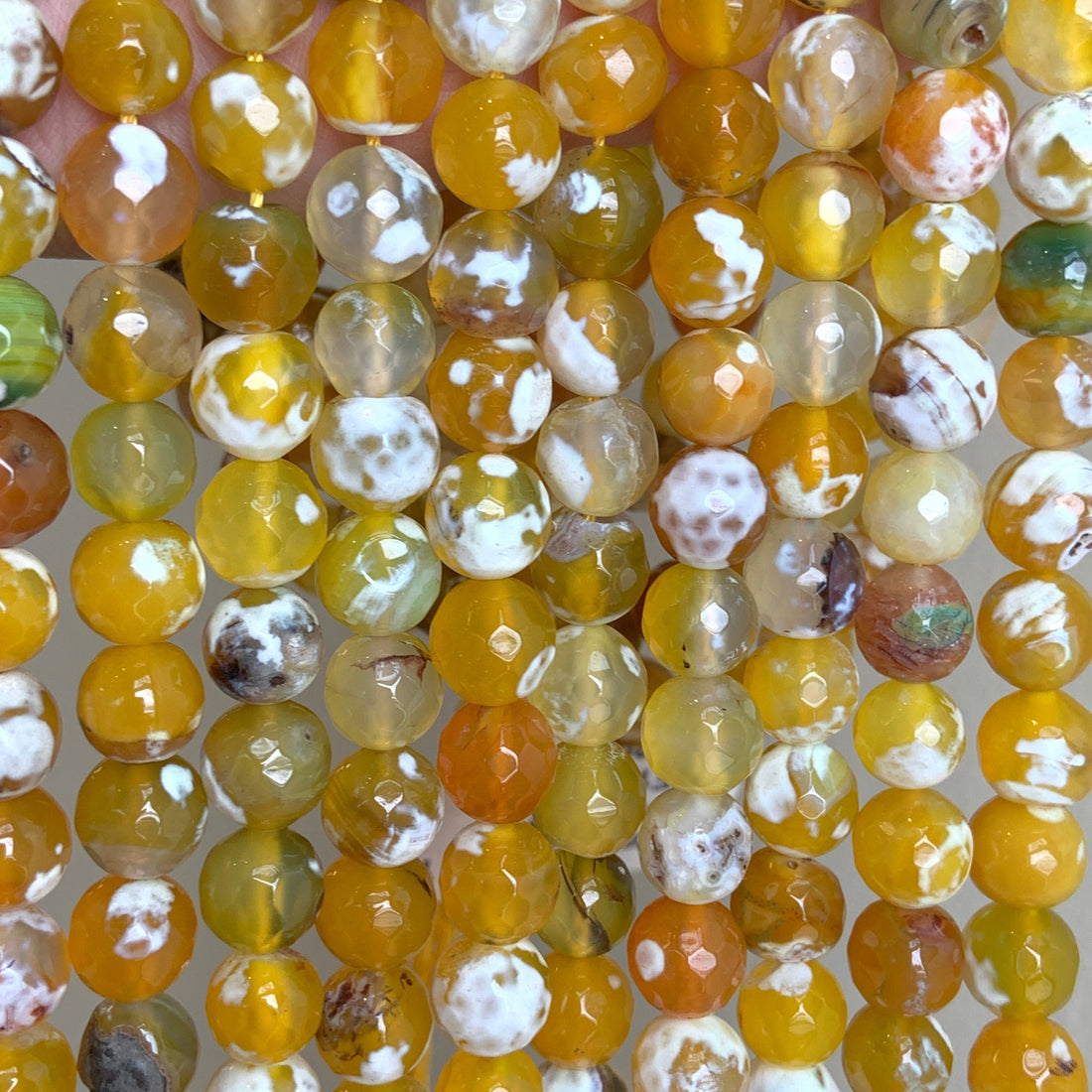 Orange Fire Agate, Faceted Round, Strands are held together