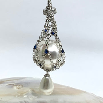 Silver pearl cage necklace