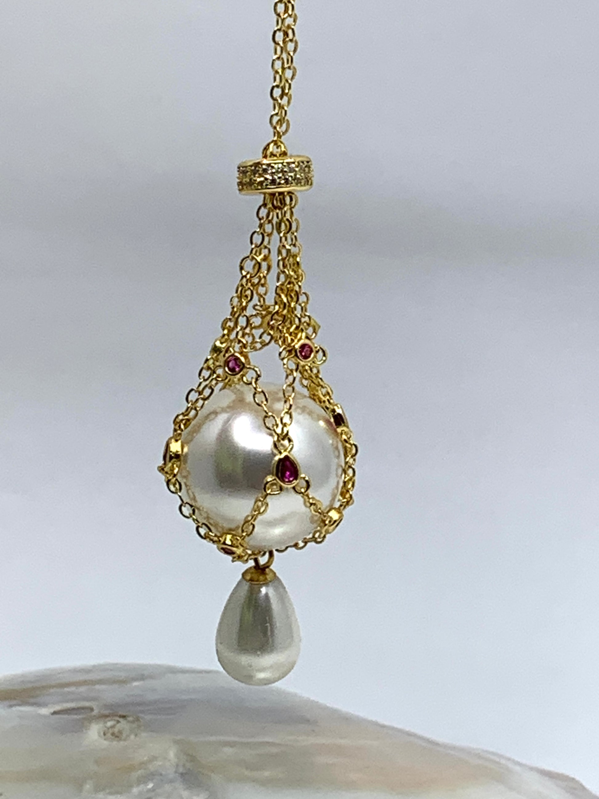 Gold pearl cage necklace