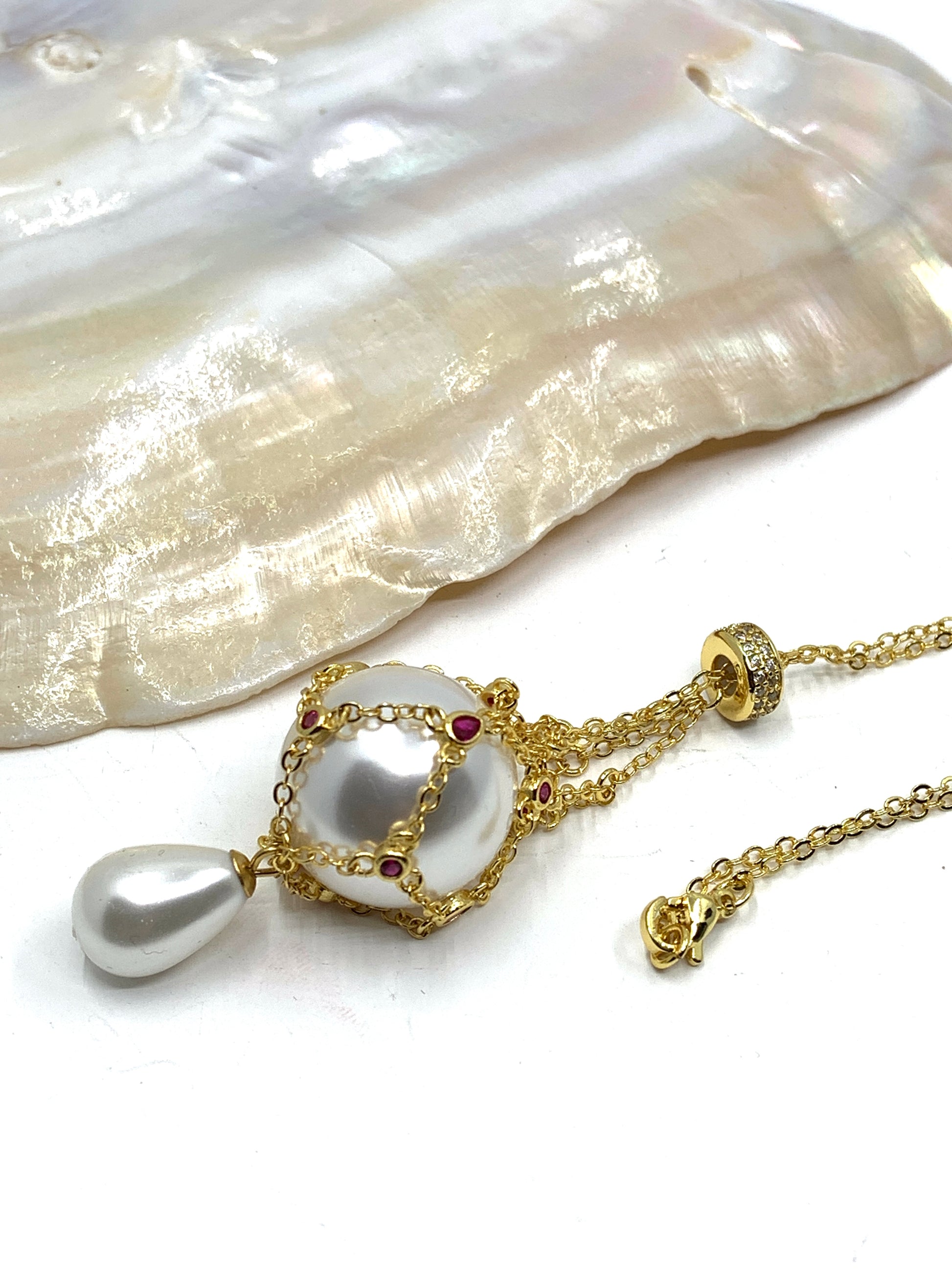 Gold pearl cage necklace