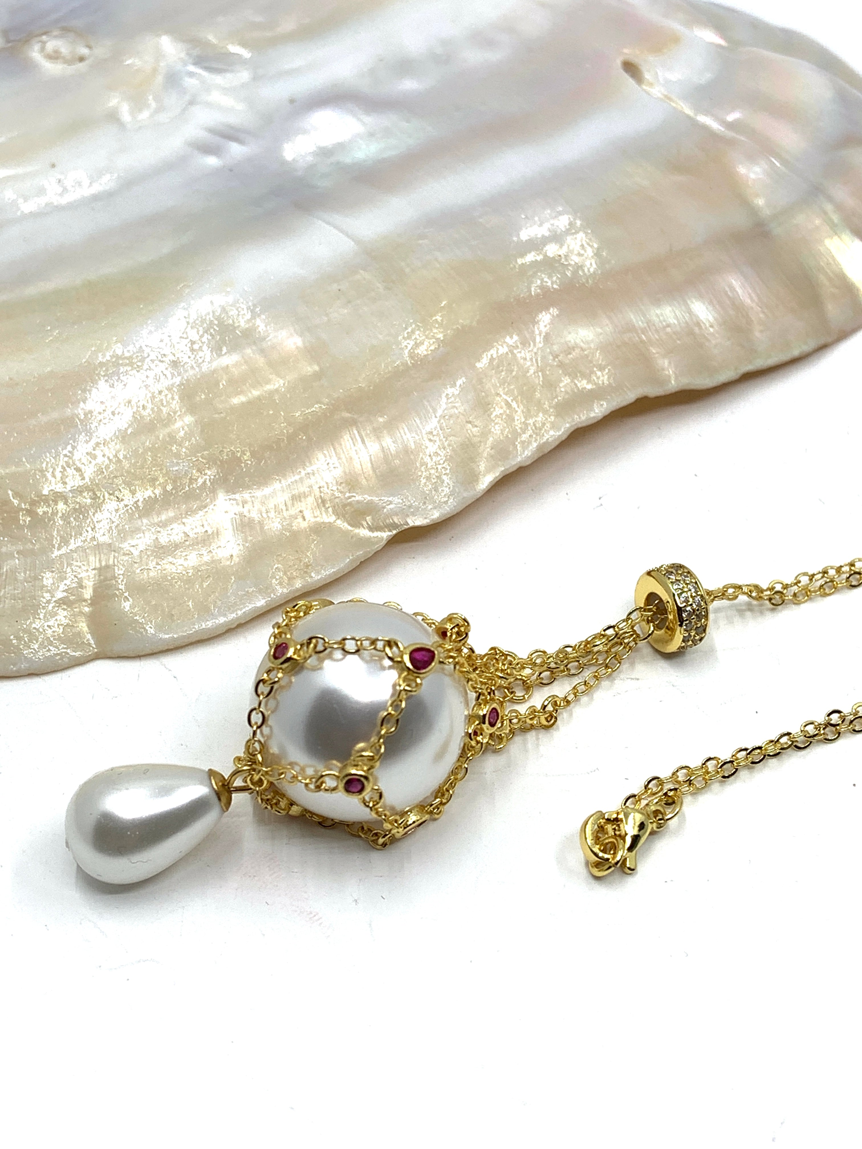 Gold pearl cage necklace