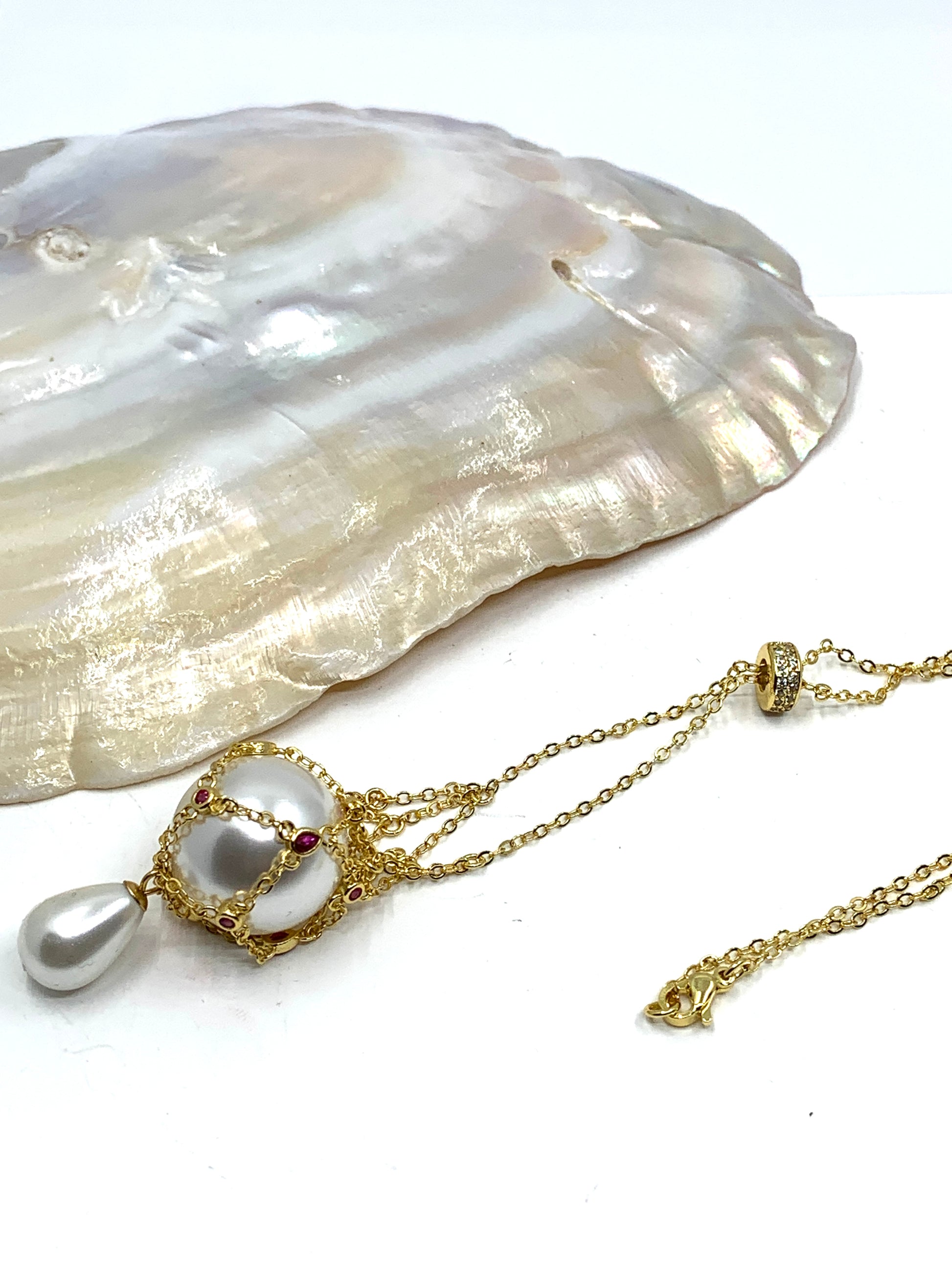 Gold pearl cage necklace