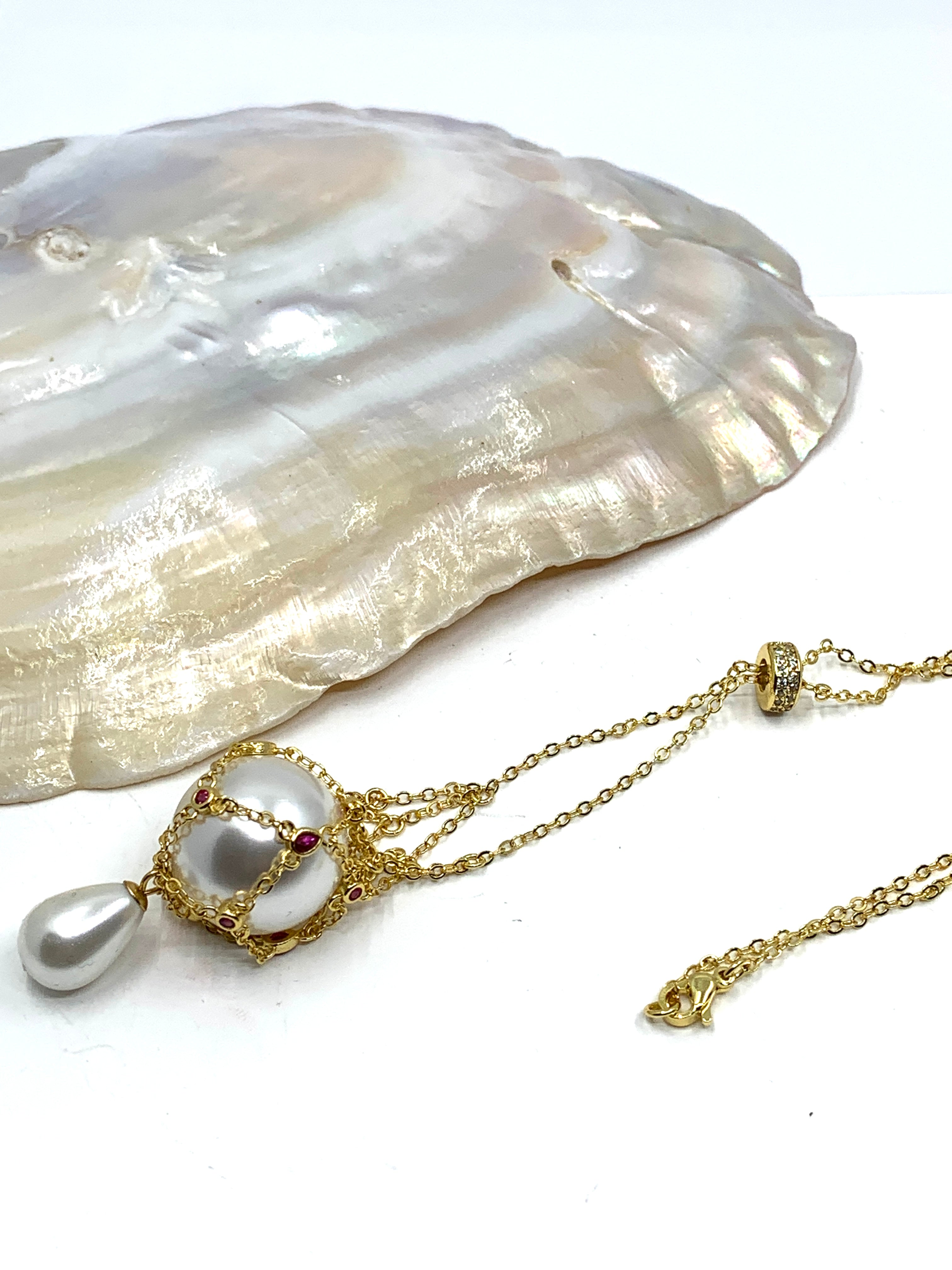Gold pearl cage necklace
