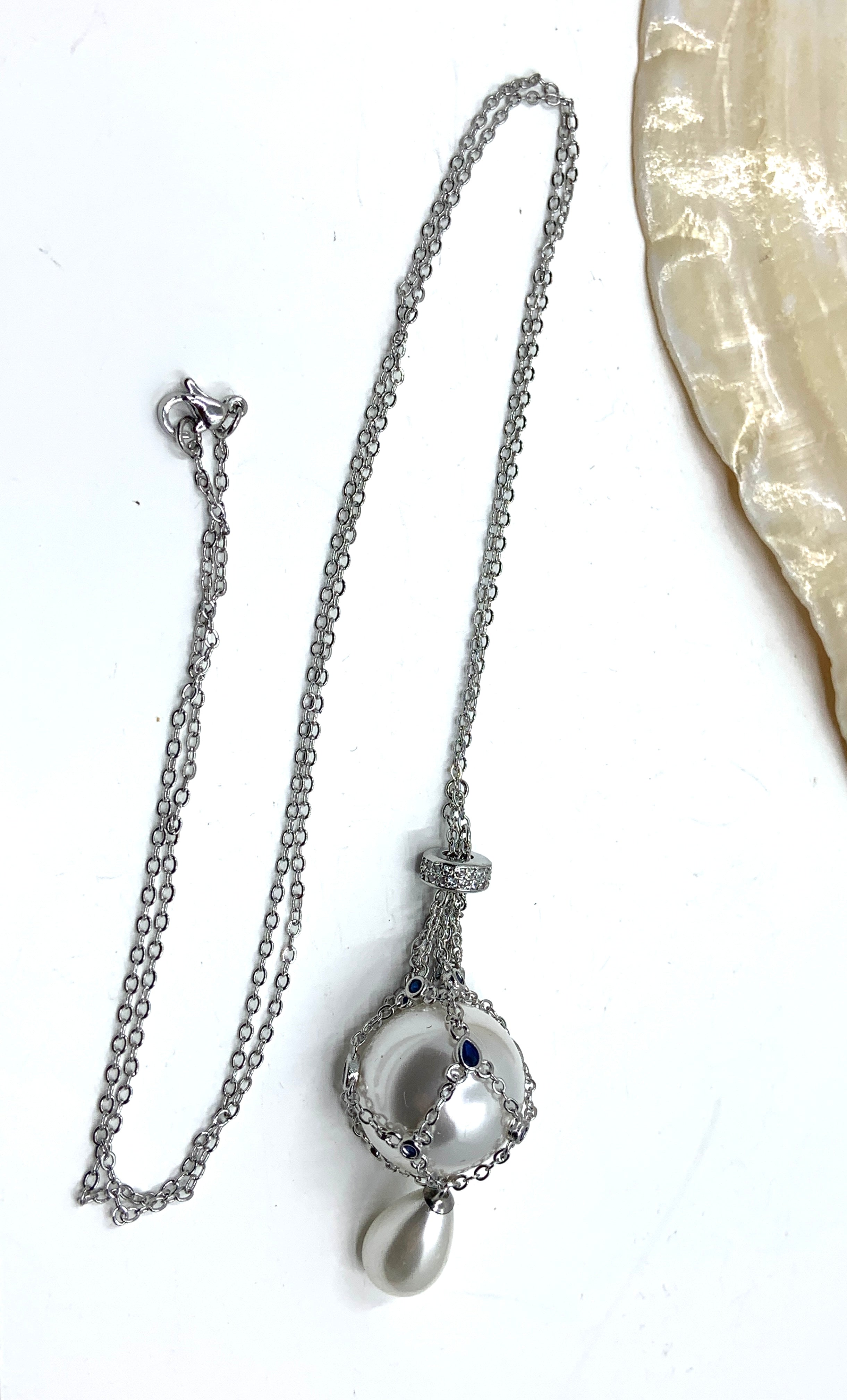 Silver  pearl cage necklace