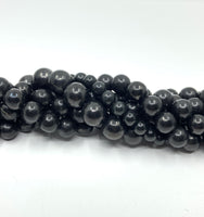 Shungite bead strands twisted onto each other