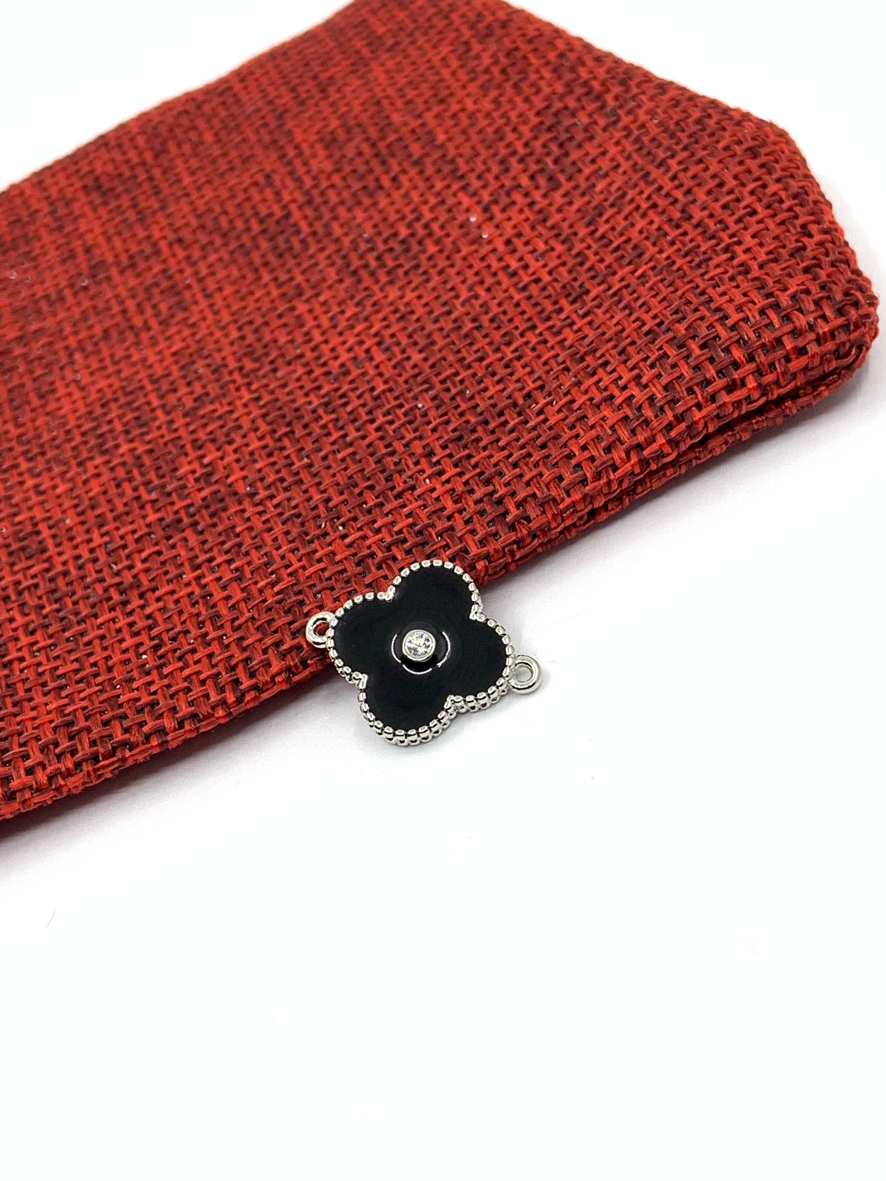 Black enamel clover connector