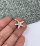 Cute starfish charm pendant on hand for size reference