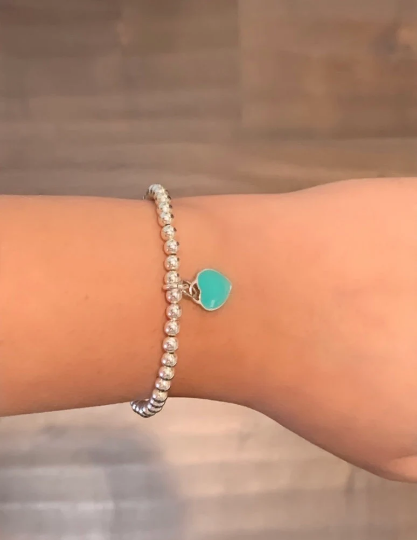Sterling Silver Ball Bead Bracelet with Heart worn on hand for size reference 