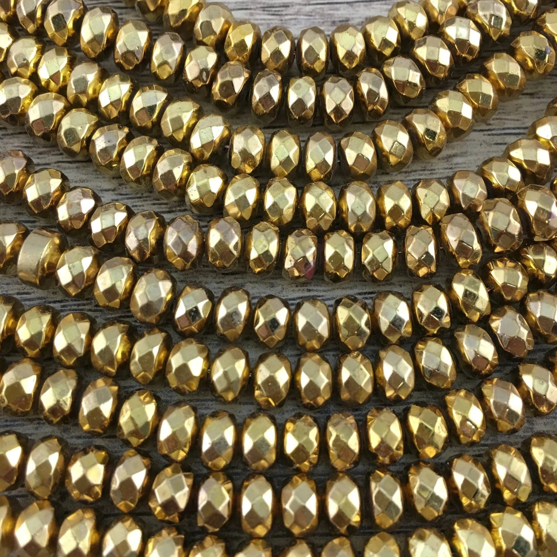 Donut Gold Faceted Hematite Bead | Bellaire Wholesale