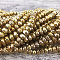 Gold Faceted Donut Hematite beads rolled together