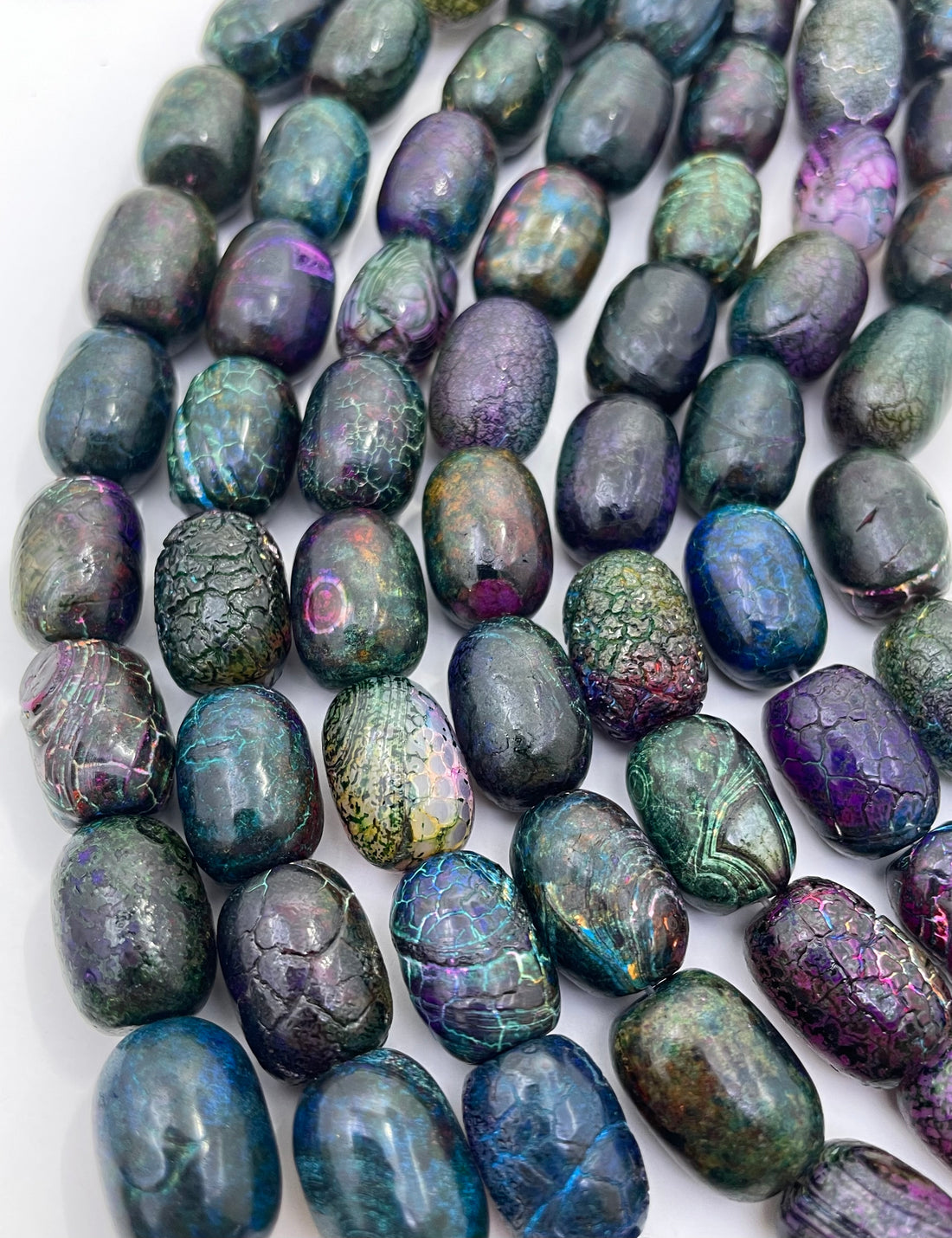 Galaxy Agate beads on a hand for size reference