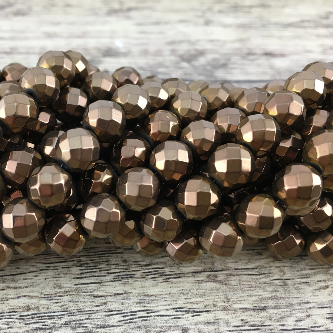6mm Bronze Faceted Hematite Bead | Bellaire Wholesale