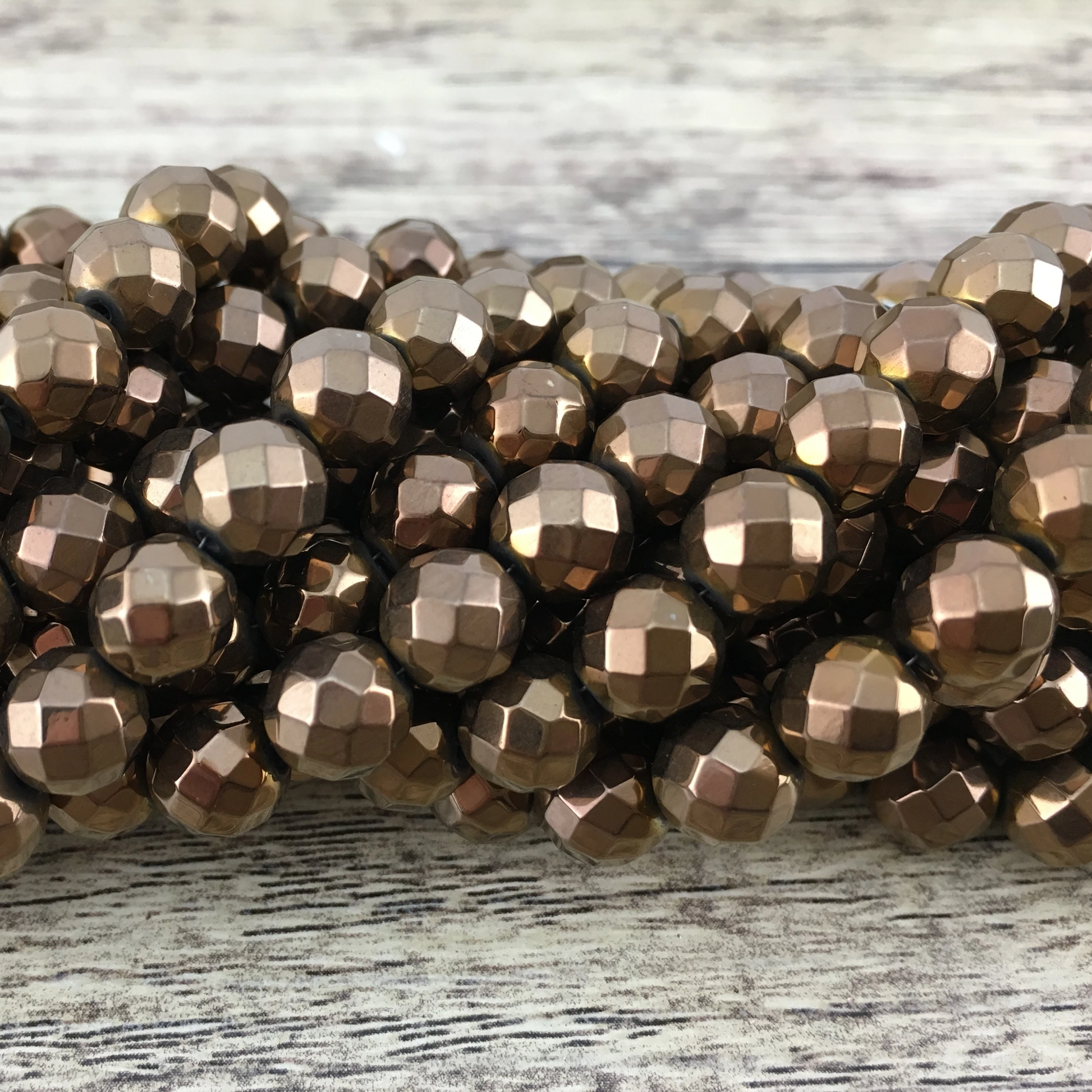 6mm Bronze Faceted Hematite Bead | Bellaire Wholesale