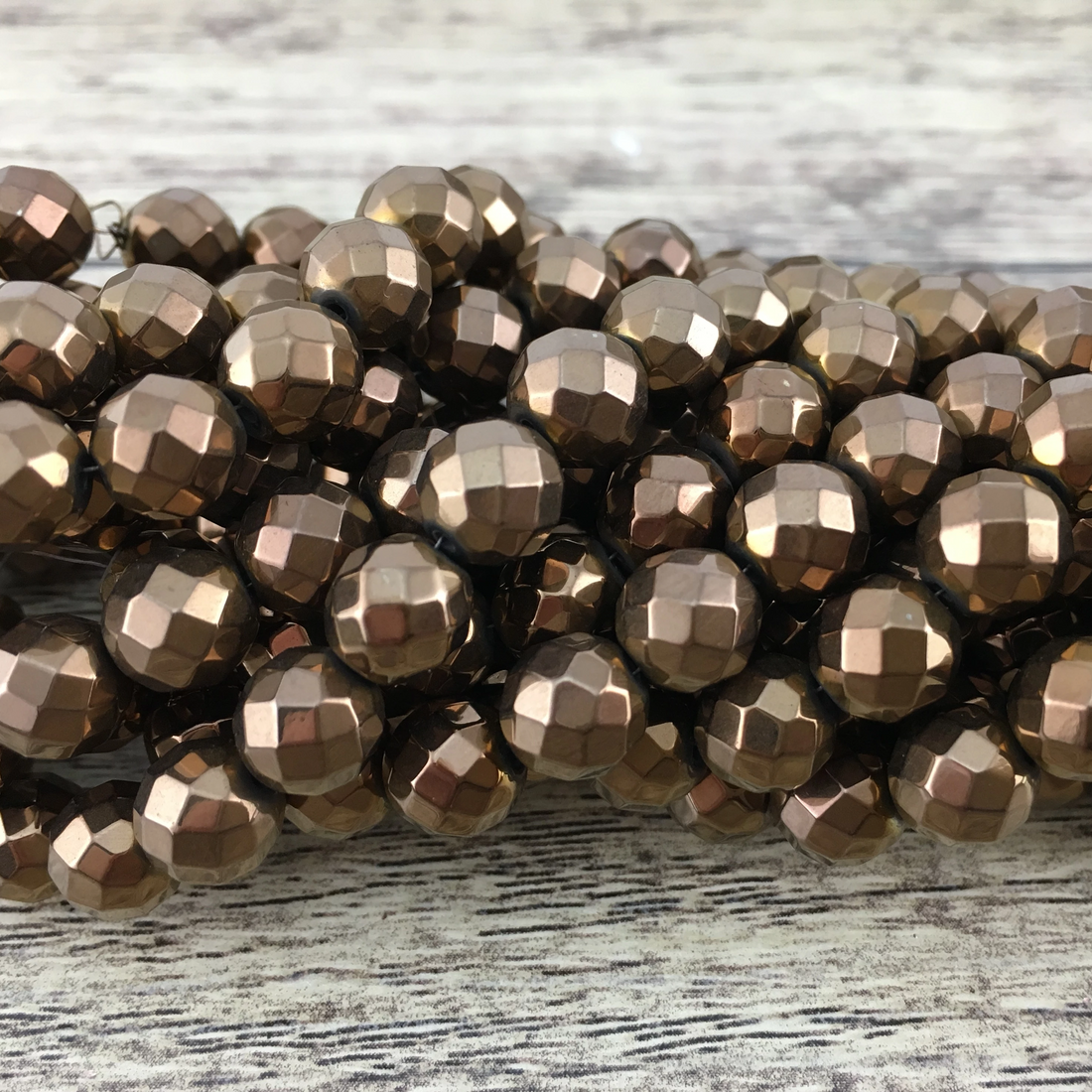 4mm Bronze Faceted Hematite Bead | Bellaire Wholesale