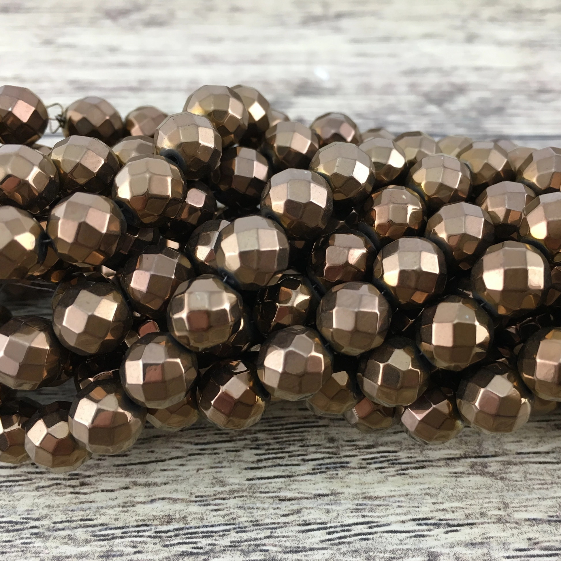 4mm Bronze Faceted Hematite Bead | Bellaire Wholesale