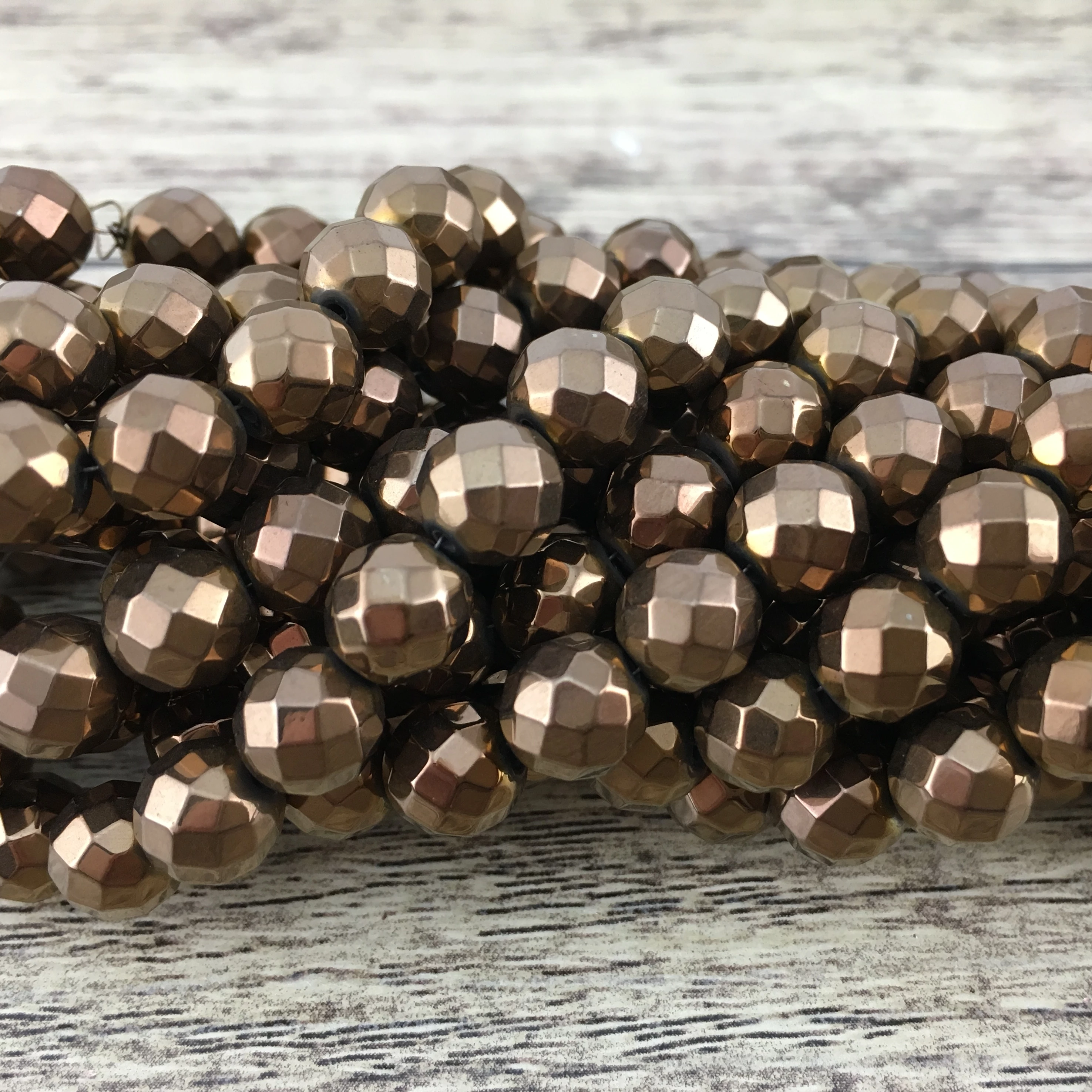 4mm Bronze Faceted Hematite Bead | Bellaire Wholesale