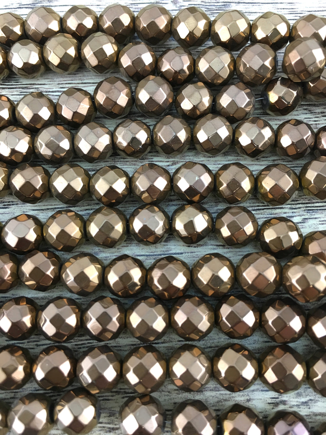 6mm Bronze Faceted Hematite Bead | Bellaire Wholesale
