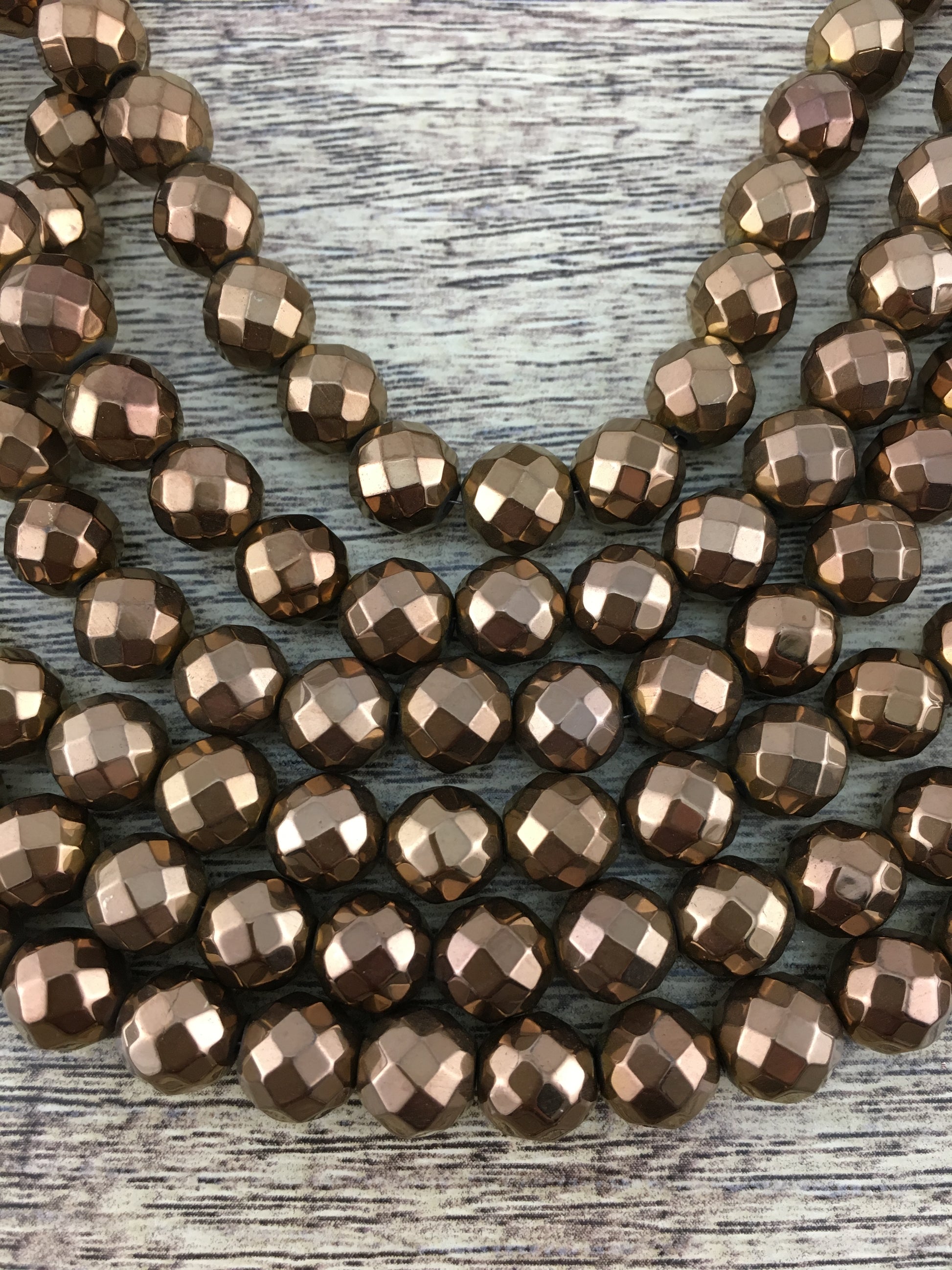 8mm Bronze Faceted Hematite Bead | Bellaire Wholesale