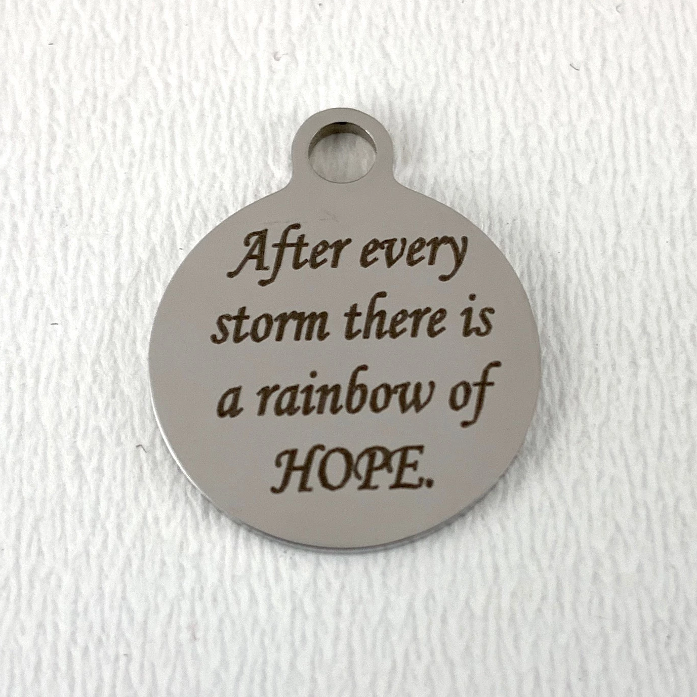 After every storm there is... Engraved Charm | Bellaire Wholesale