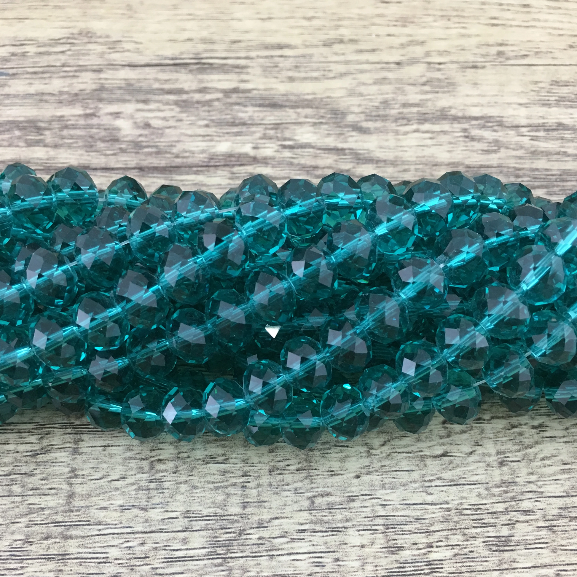 Faceted Rondelle Emerald Green Glass Bead | Bellaire Wholesale