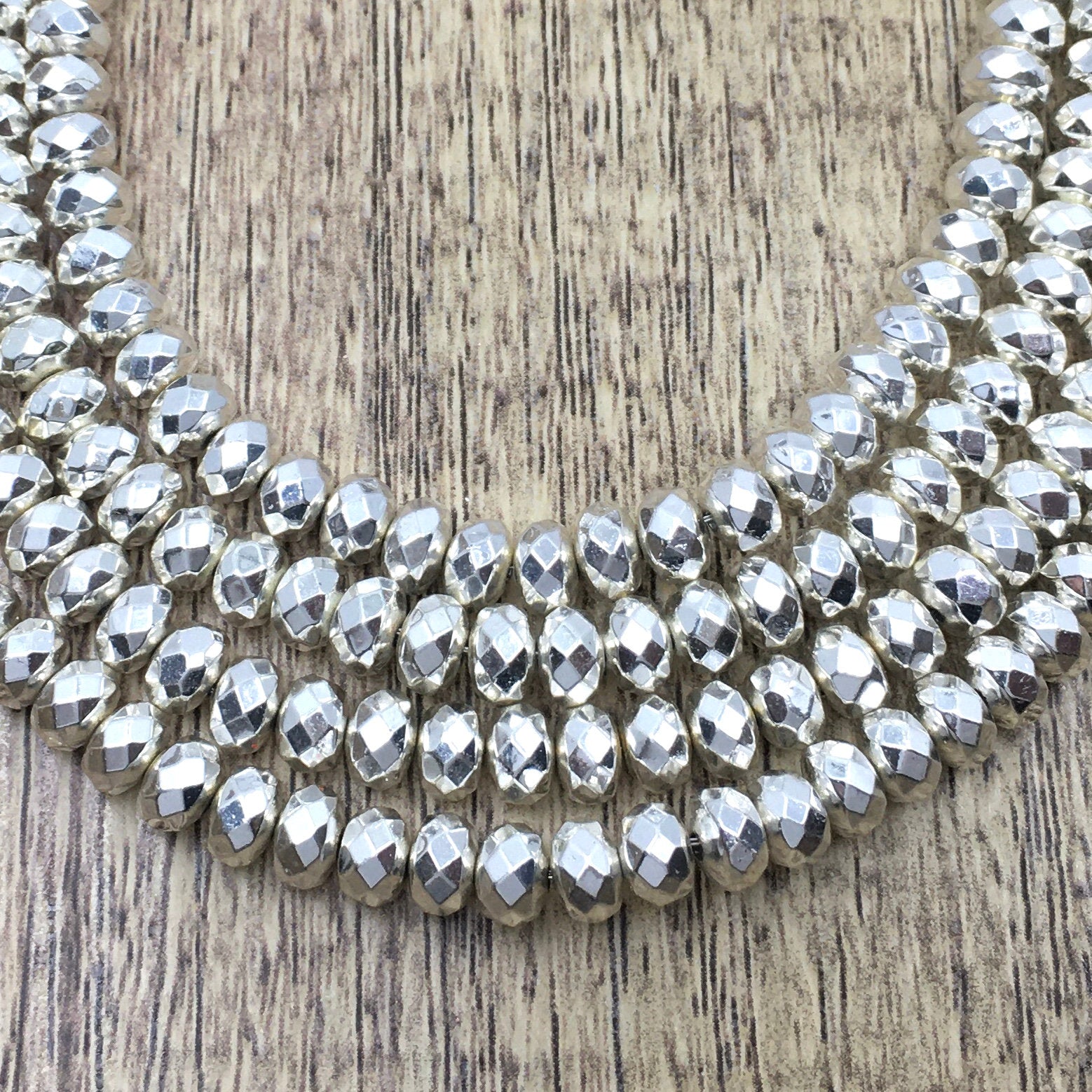 6mm Donut Silver Faceted Hematite Bead | Bellaire Wholesale