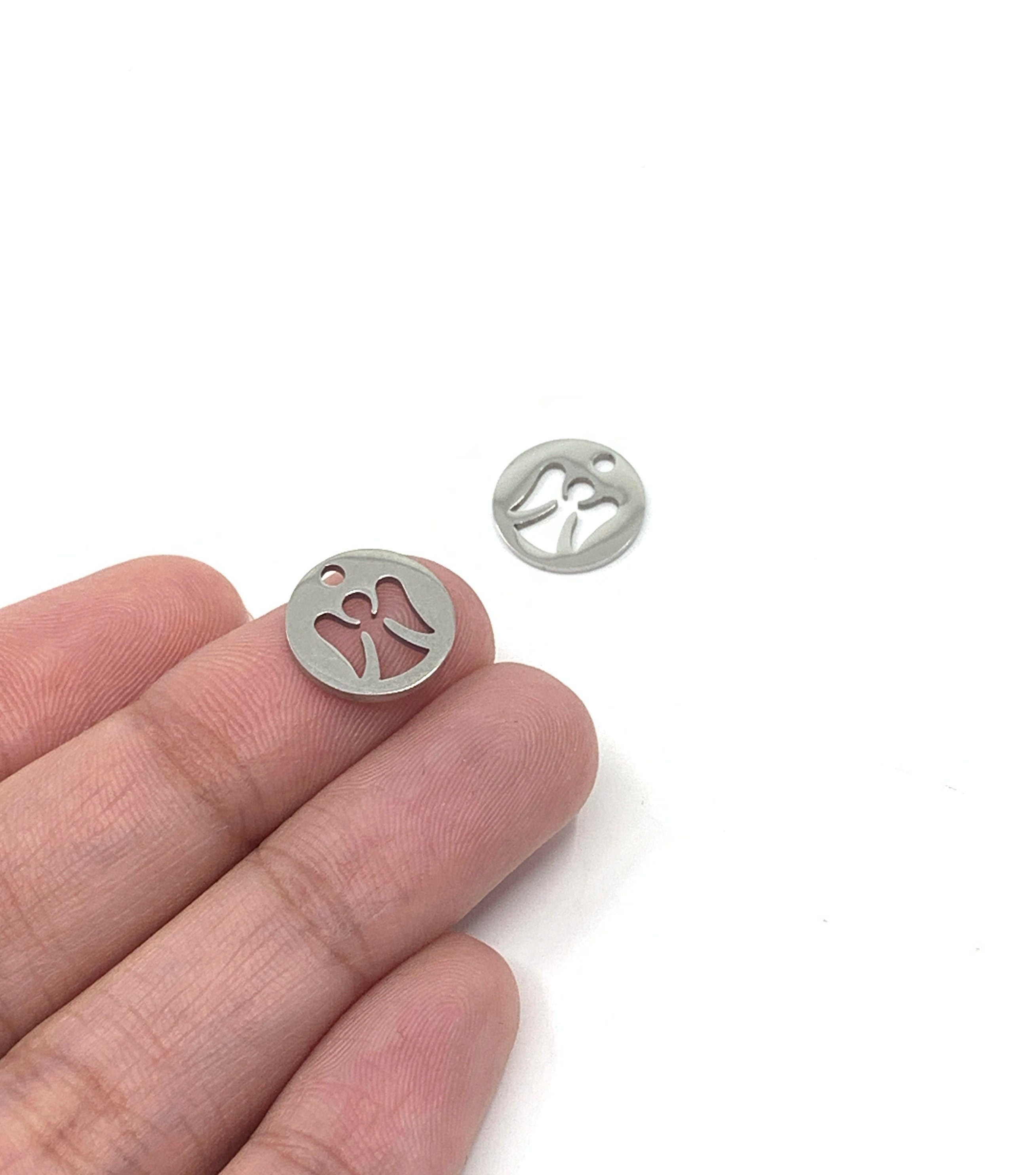 Stainless Steel Angel Charm shown on hand for size reference 