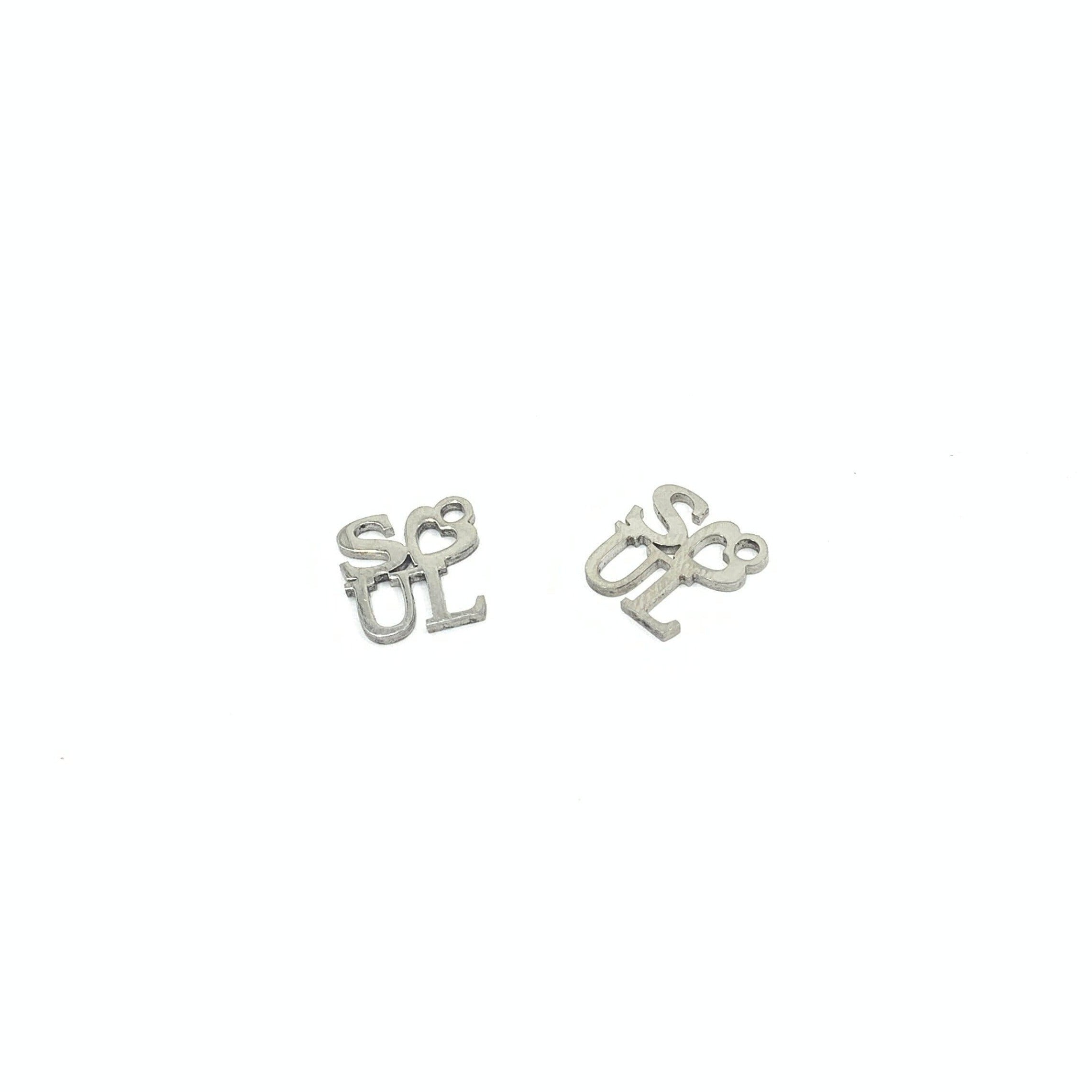 Soul writing charms against a white background 