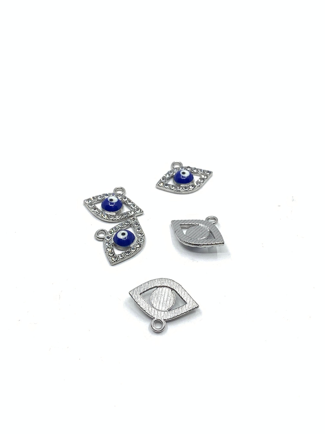 5 evil eye charms with clear rhinestones on the borders and blue evil eye in the center.