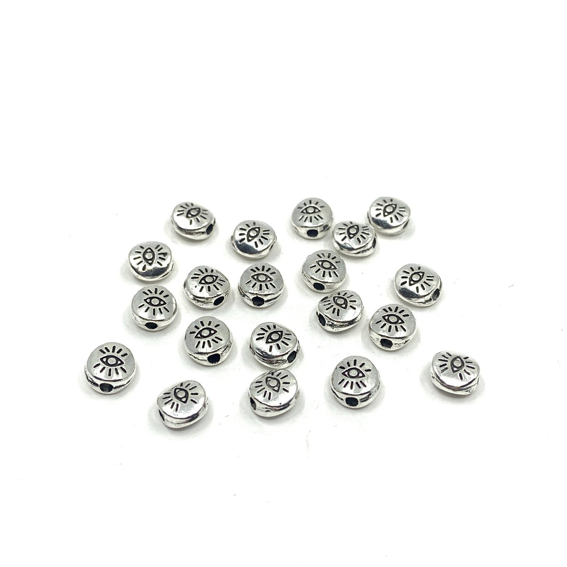 20pcs Flat round Tibetan Style Evil eye beads shown against a white background